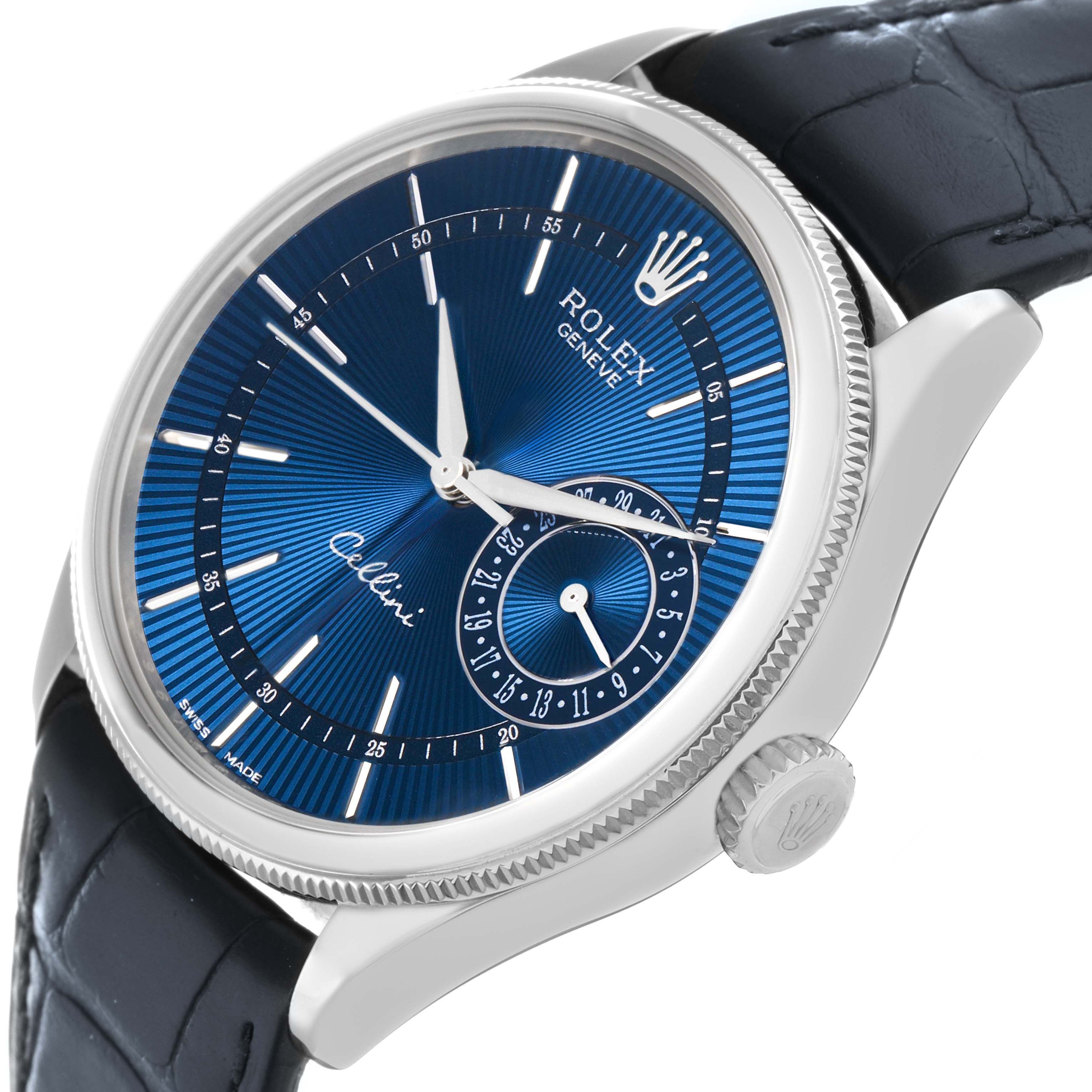 The Rolex Cellini 50519 Men
s White Gold Blue Dial watch is shown from a side angle, displaying the blue dial, crown, and leather strap.