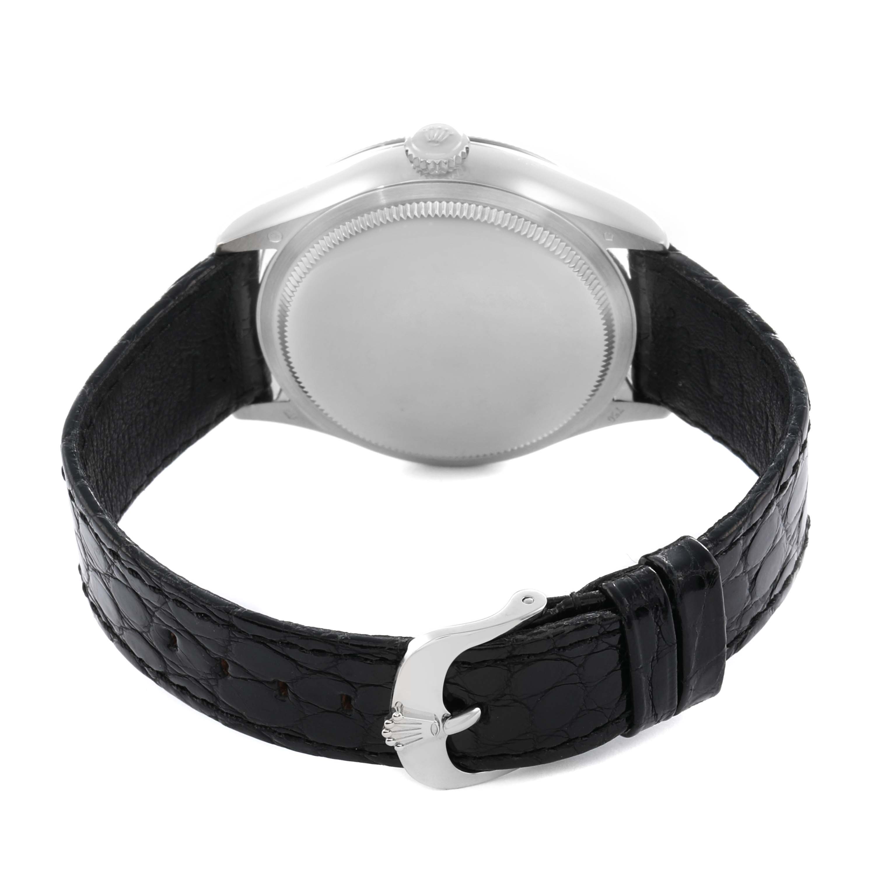 The image shows the back view of a Rolex Cellini 50519 Men
s White Gold White Dial watch, highlighting the caseback, crown, and leather strap with a clasp.