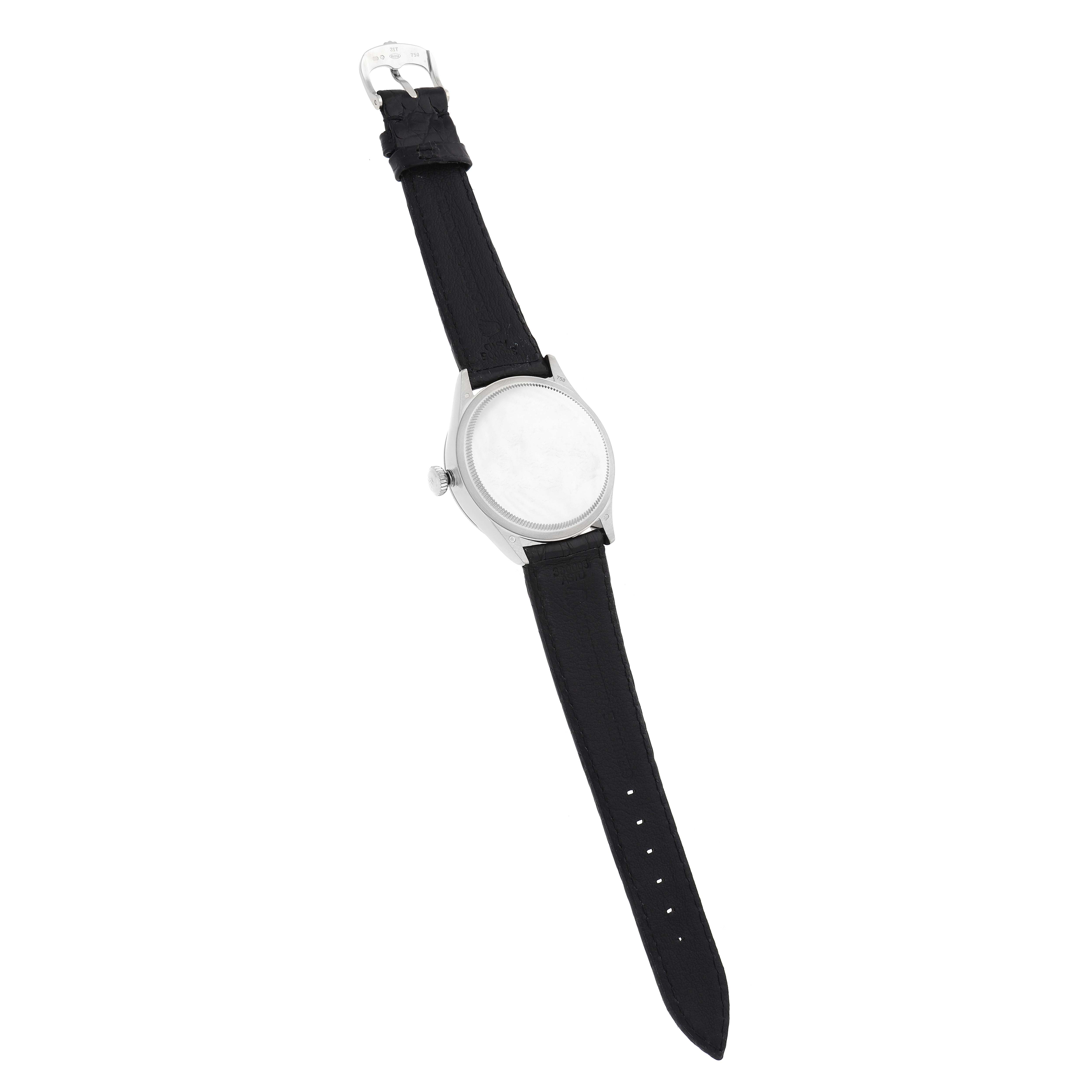 The Rolex Cellini 50519 Men
s White Gold White Dial watch is shown at a slight side angle, displaying the strap, case, bezel, and crown.