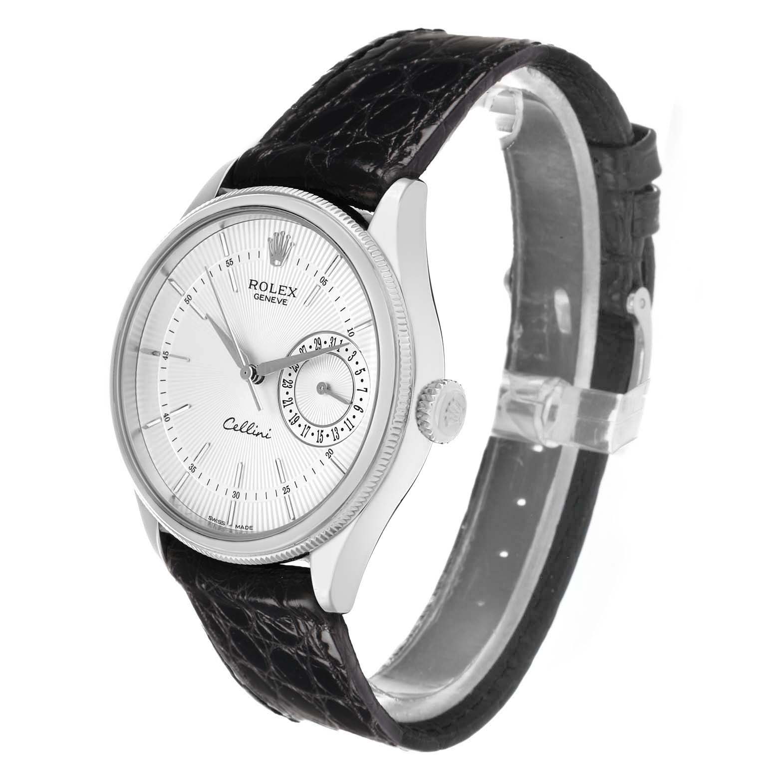 The Rolex Cellini 50519 Men
s White Gold White Dial watch is shown at an angled front view, highlighting its face, crown, and textured black strap.