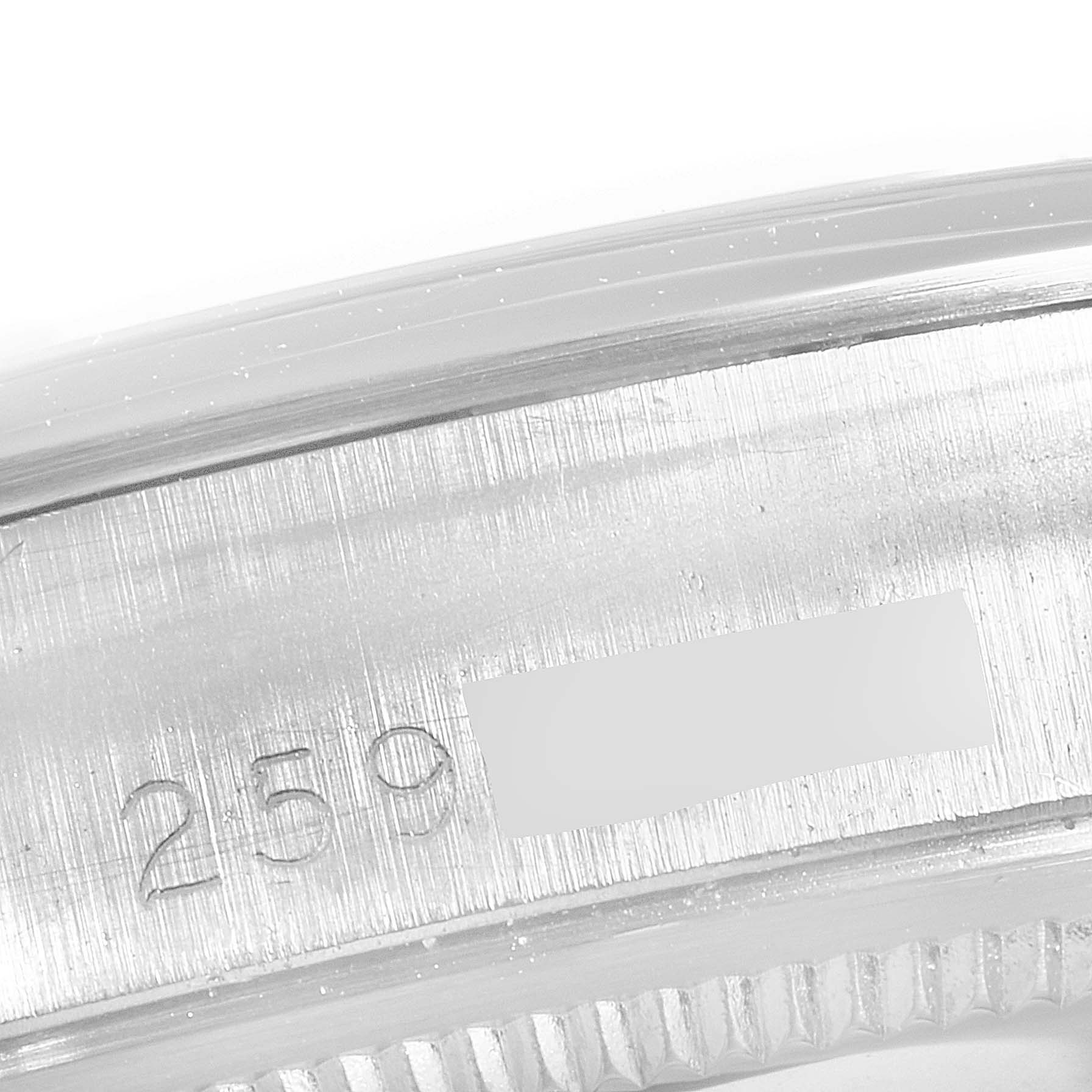 This close-up image shows the serial number engraved on the side of a Rolex Date 1500 Men's Stainless Steel Grey Dial 1500 Men's Stainless Steel Grey Dial watch case.