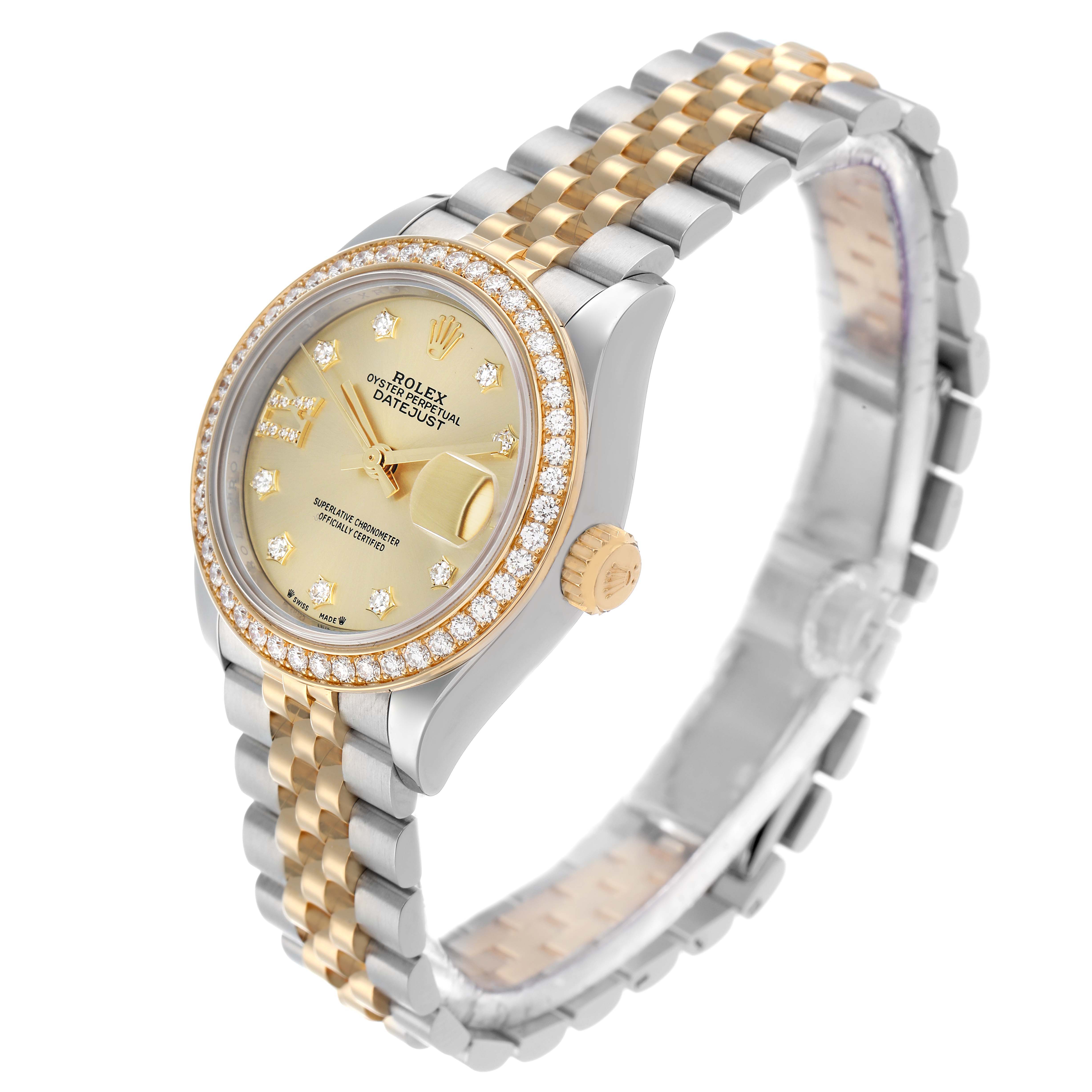 The Rolex Datejust 279383 Women
s Steel and Gold (two tone) Champagne Dial watch is shown at an angle highlighting the face, bezel, crown, and two-tone bracelet.