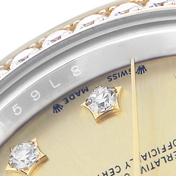 The image shows a close-up of the Rolex Datejust 279383 Women
s Steel and Gold (two tone) Champagne Dial dial, highlighting diamond hour markers and part of the bezel.
