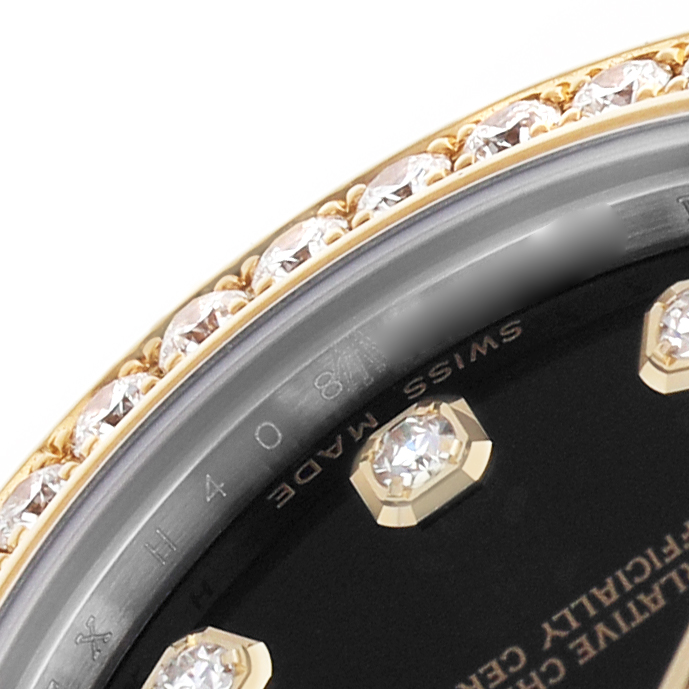 The image shows a close-up of the bezel and dial edge of a Rolex Datejust 178383 Women's Steel and Gold (two tone) Black Dial, featuring diamonds.