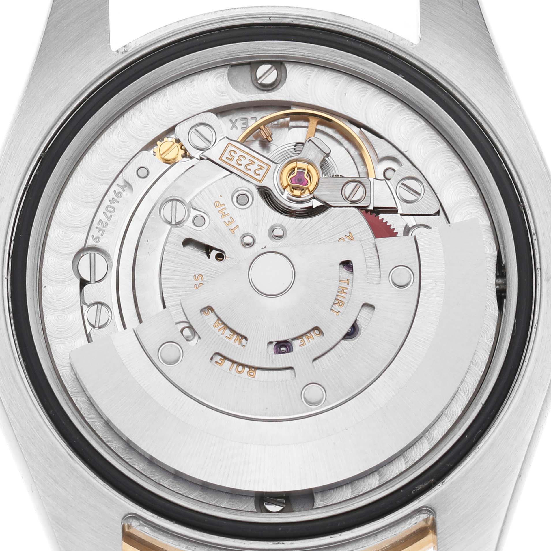 This image shows the movement mechanism of a Rolex Datejust 178383 Women's Steel and Gold (two tone) Black Dial watch from a close-up, internal angle, highlighting its intricate components.