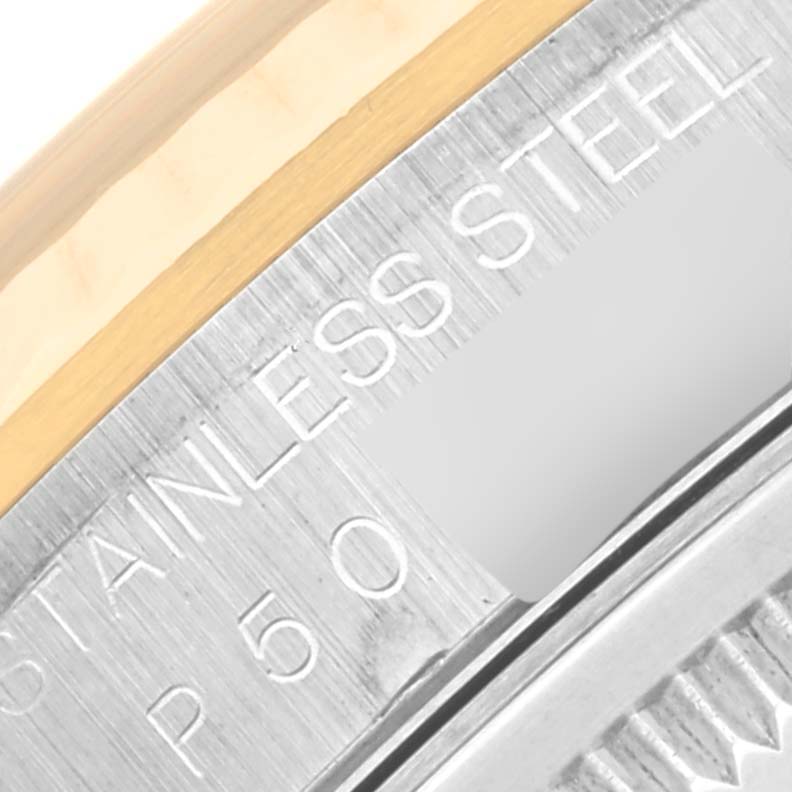 This image shows a close-up of the side engraving and edge of the bezel of a Rolex Datejust 16233 Men's Steel and Gold (two tone) Black Dial 16233 Men's Steel and Gold (two tone) Black Dial model, highlighting the "STAINLESS STEEL" text.