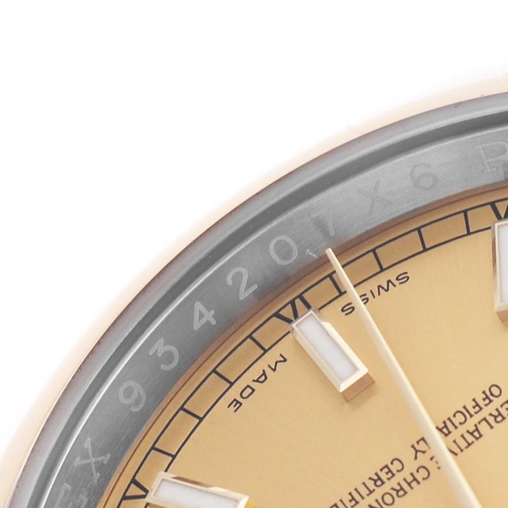The image shows a close-up of the Rolex Datejust 116203 Men's Stainless Steel Champagne Dial watch's partial dial, indices, and the serial number on the rehaut.