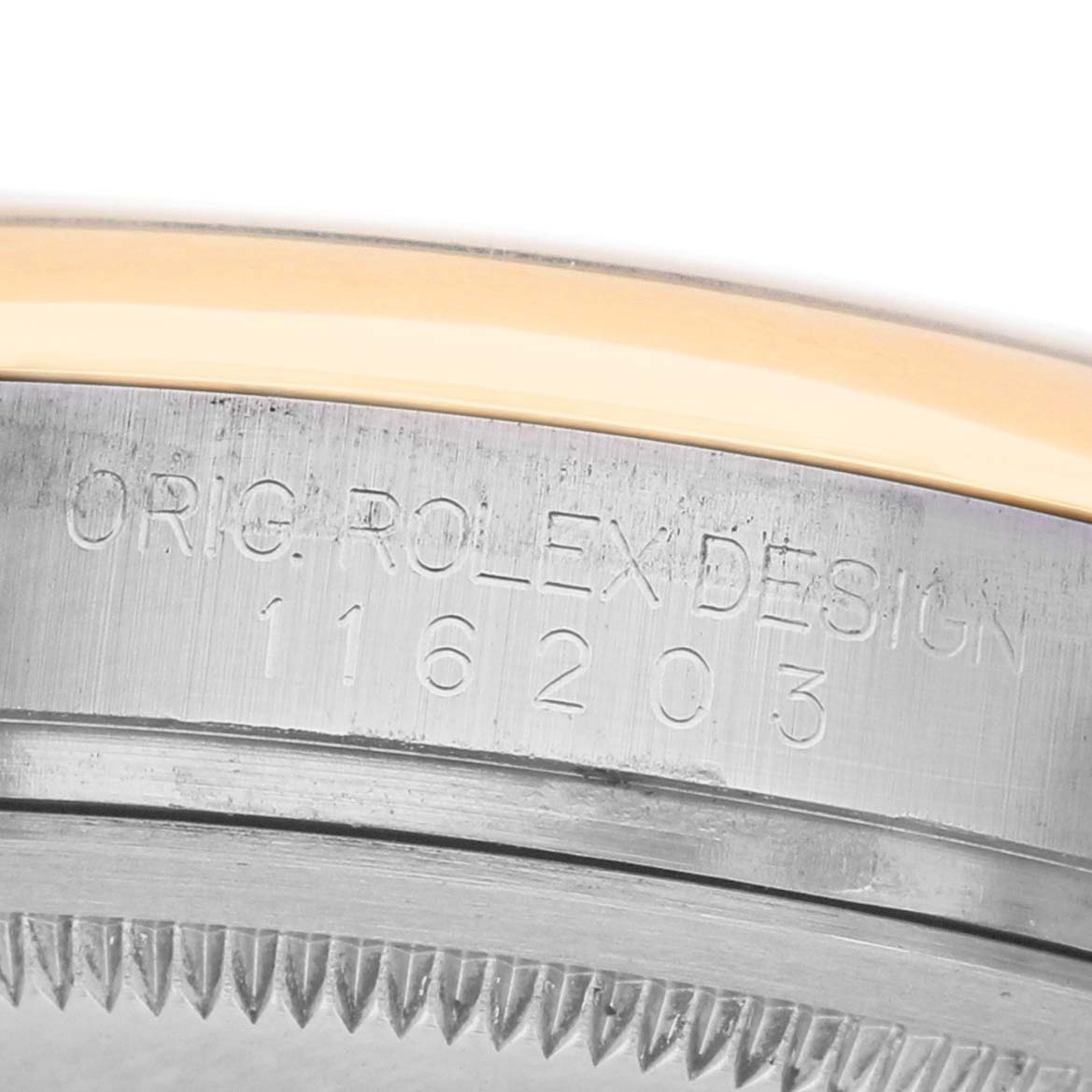 The image shows a close-up of the engraved case side of the Rolex Datejust 116203 Men's Stainless Steel Champagne Dial, displaying the model number.