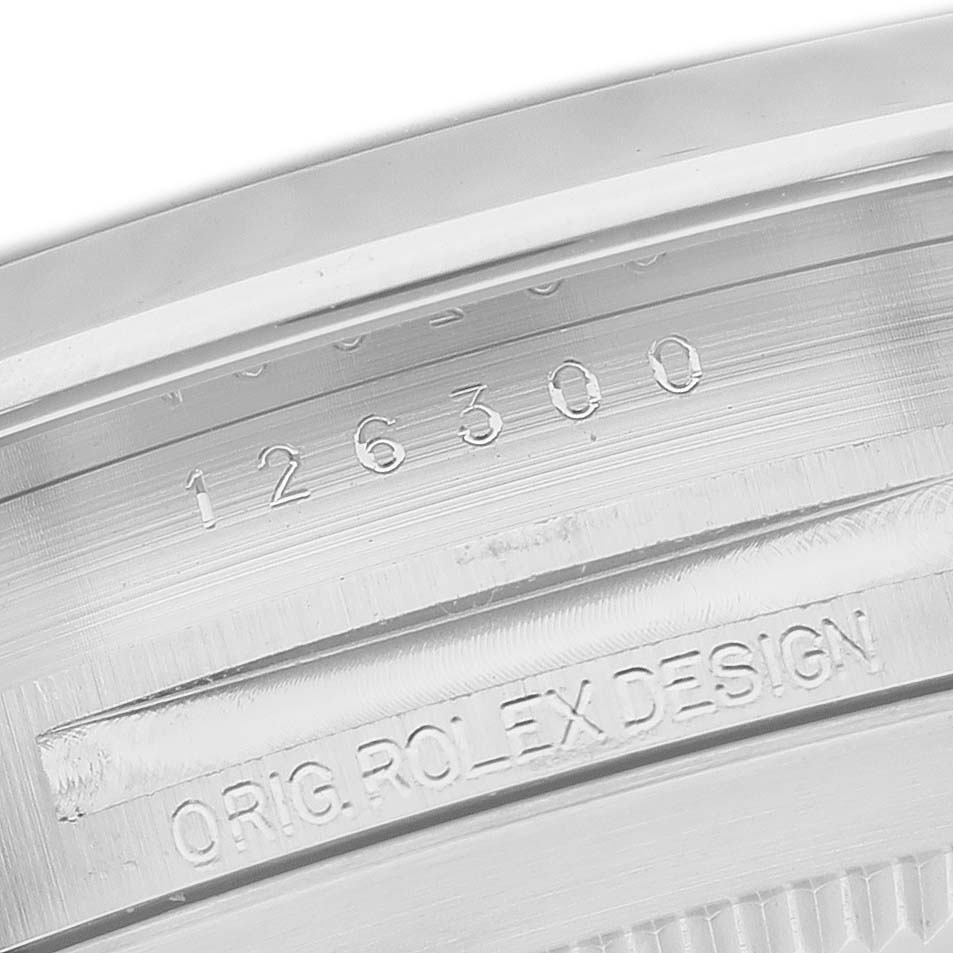 The image shows a close-up of the Rolex Datejust 41 126300 Men's Stainless Steel Black Dial model's case side with engravings.