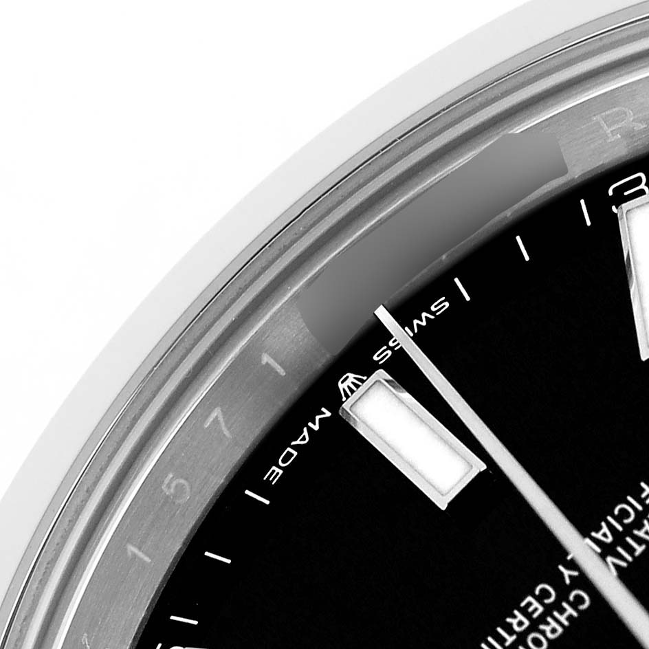 This close-up shows the dial, markers, and part of the bezel of the Rolex Datejust 41 126300 Men's Stainless Steel Black Dial.
