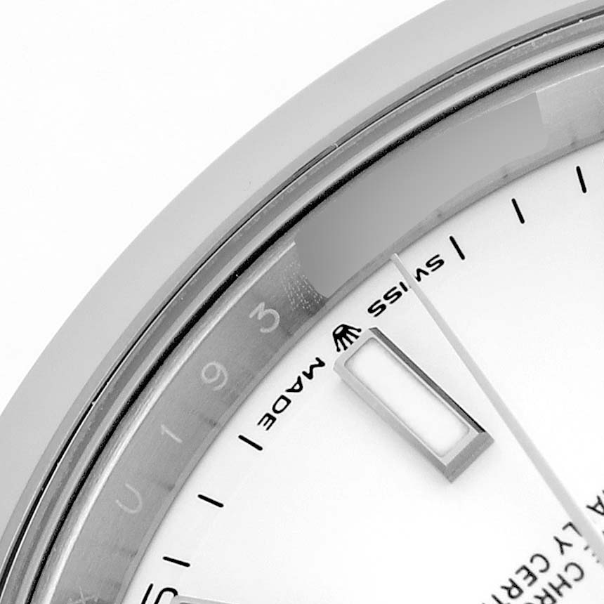 The image shows a partial view of the Rolex Datejust 41 126300 Men's Stainless Steel White Dial, focusing on the dial, hour markers, and bezel.
