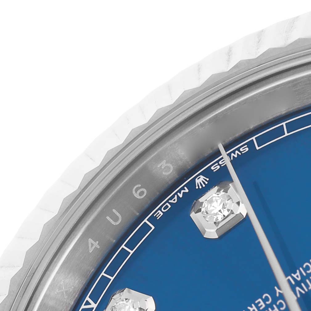 The image shows a close-up of the Rolex Datejust 41 126334 Men's Steel and Gold (two tone) Blue Dial watch's blue dial, bezel, and diamond hour markers.