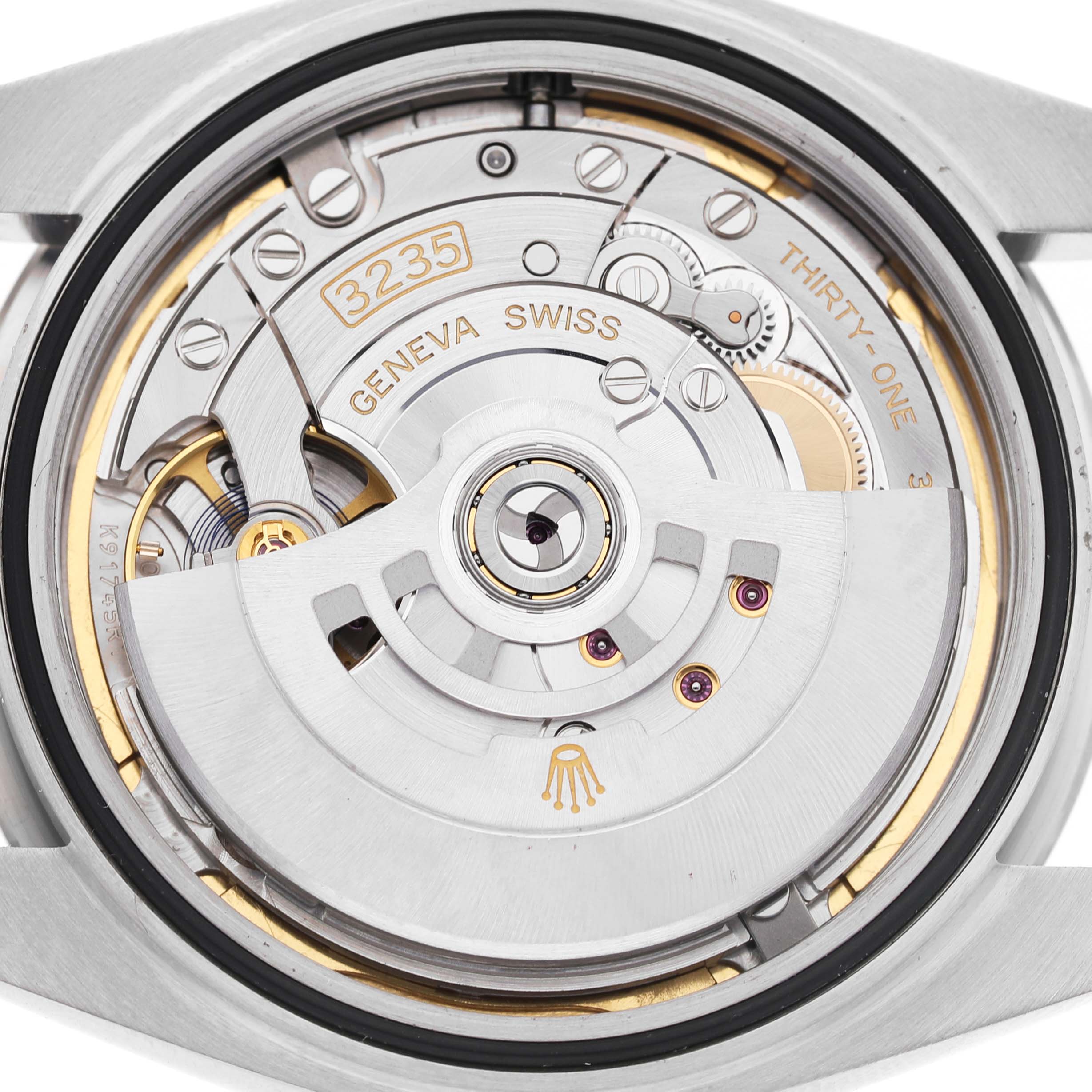 The image shows the Rolex Datejust 41 126334 Men's Steel and Gold (two tone) Blue Dial's movement, viewed from the back, highlighting its intricate mechanics.