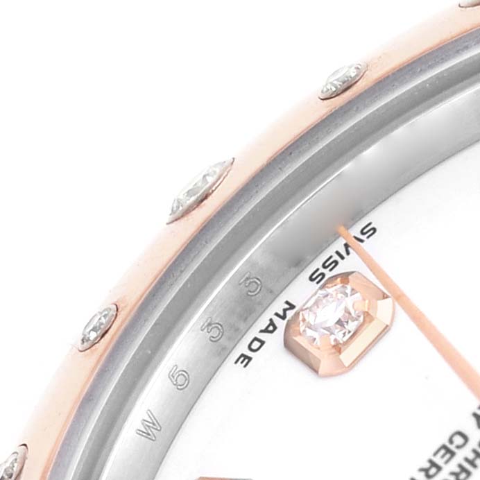 The image shows a close-up of the Rolex Datejust 178341 Women's Steel and Gold (two tone) White Dial watch, focusing on the bezel, part of the dial, and a diamond hour marker.