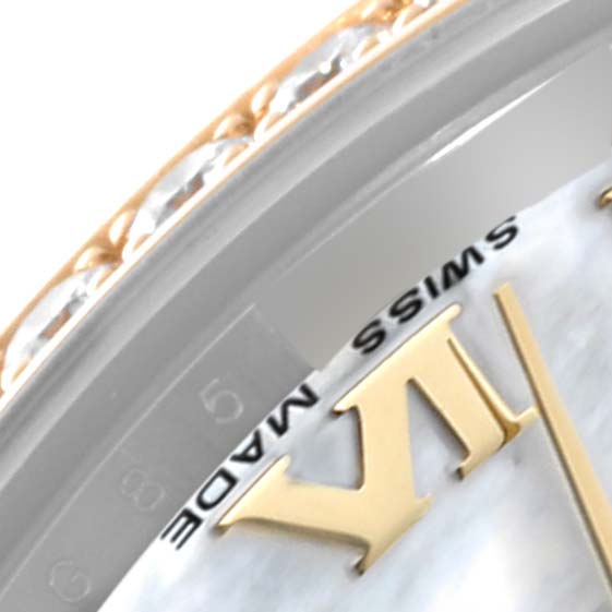 The image shows a close-up of the bezel and dial of a Rolex Mid-Size 178383 Women's Steel and Gold (two tone) Mother of Pearl Dial 178383 Women's Steel and Gold (two tone) Mother of Pearl Dial watch, focusing on the Roman numeral "VI" and the "SWISS MADE" inscription.