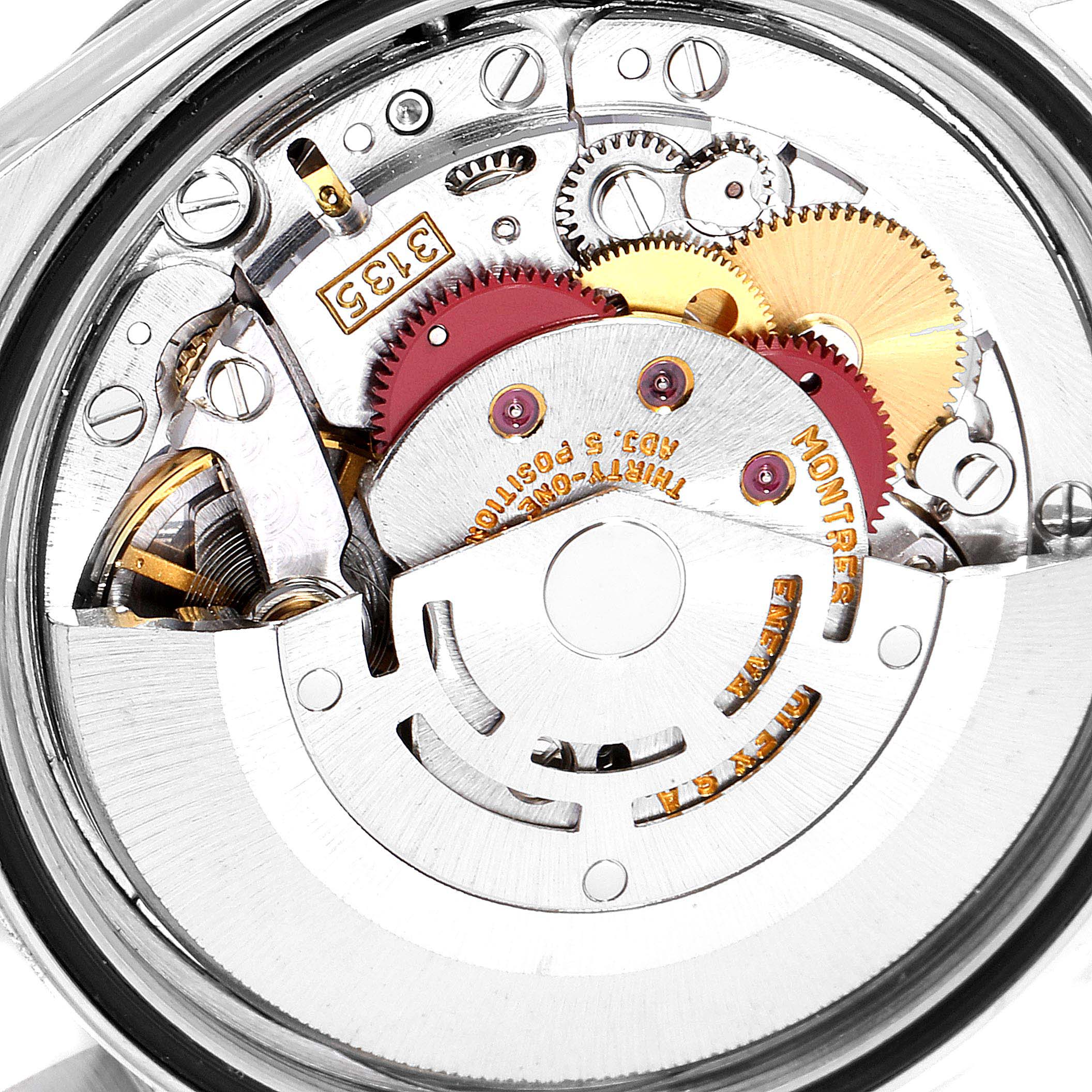 This image depicts the intricate movement and inner components of a Rolex Datejust 16233 Men
s Steel and Gold (two tone) Champagne Dial 16233 Men
s Steel and Gold (two tone) Champagne Dial model watch from a close-up angle.