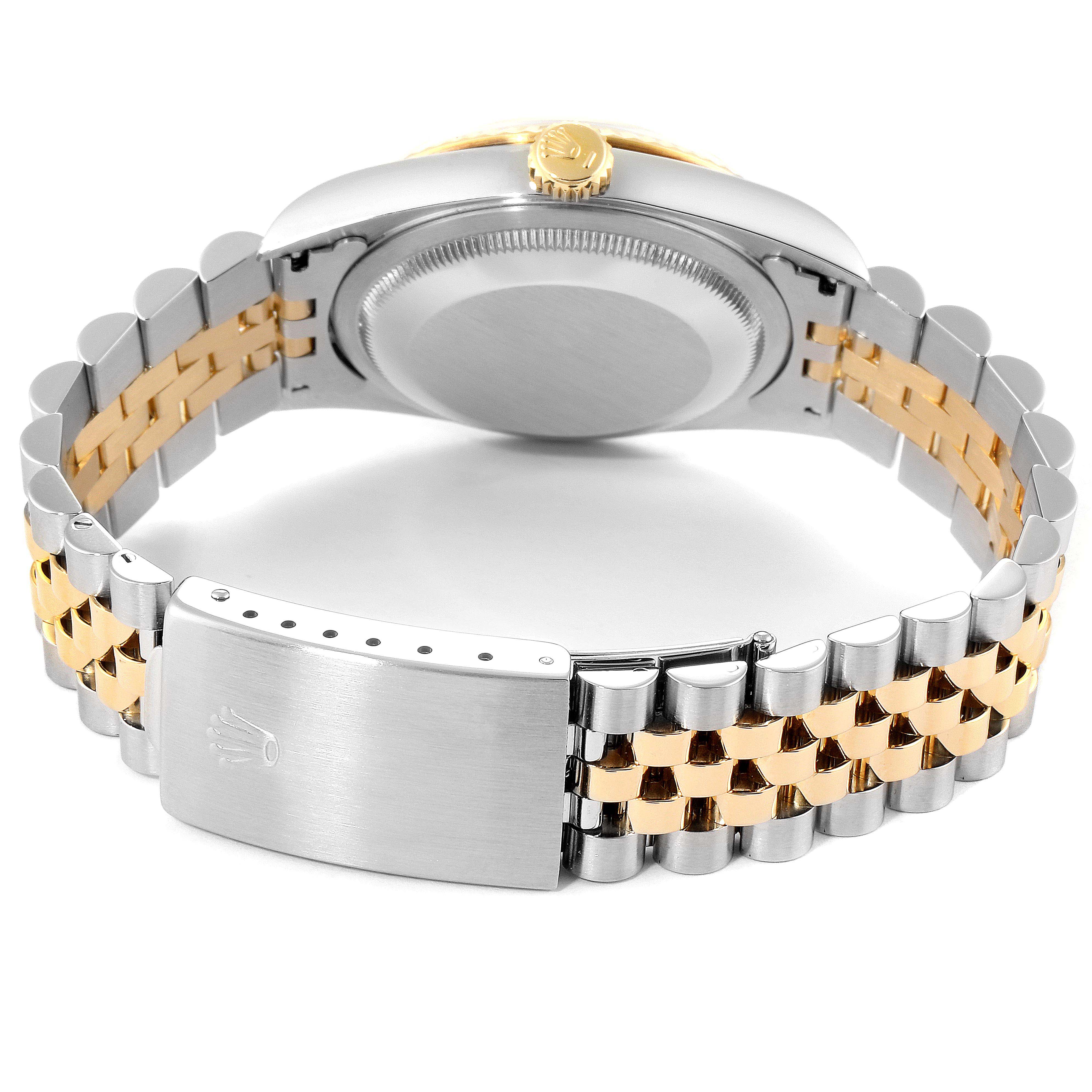 This image shows the back of a Rolex Datejust 16233 Men
s Steel and Gold (two tone) Champagne Dial 16233 Men
s Steel and Gold (two tone) Champagne Dial watch, highlighting its two-tone Jubilee bracelet and deployment clasp.