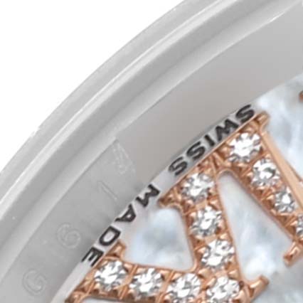 This close-up image shows a partial view of the dial and bezel of a Rolex Datejust 179171 Women's Steel and Gold (two tone) Mother of Pearl Dial 179171 Women's Steel and Gold (two tone) Mother of Pearl Dial watch, including the "Swiss Made" text and part of a jeweled number.