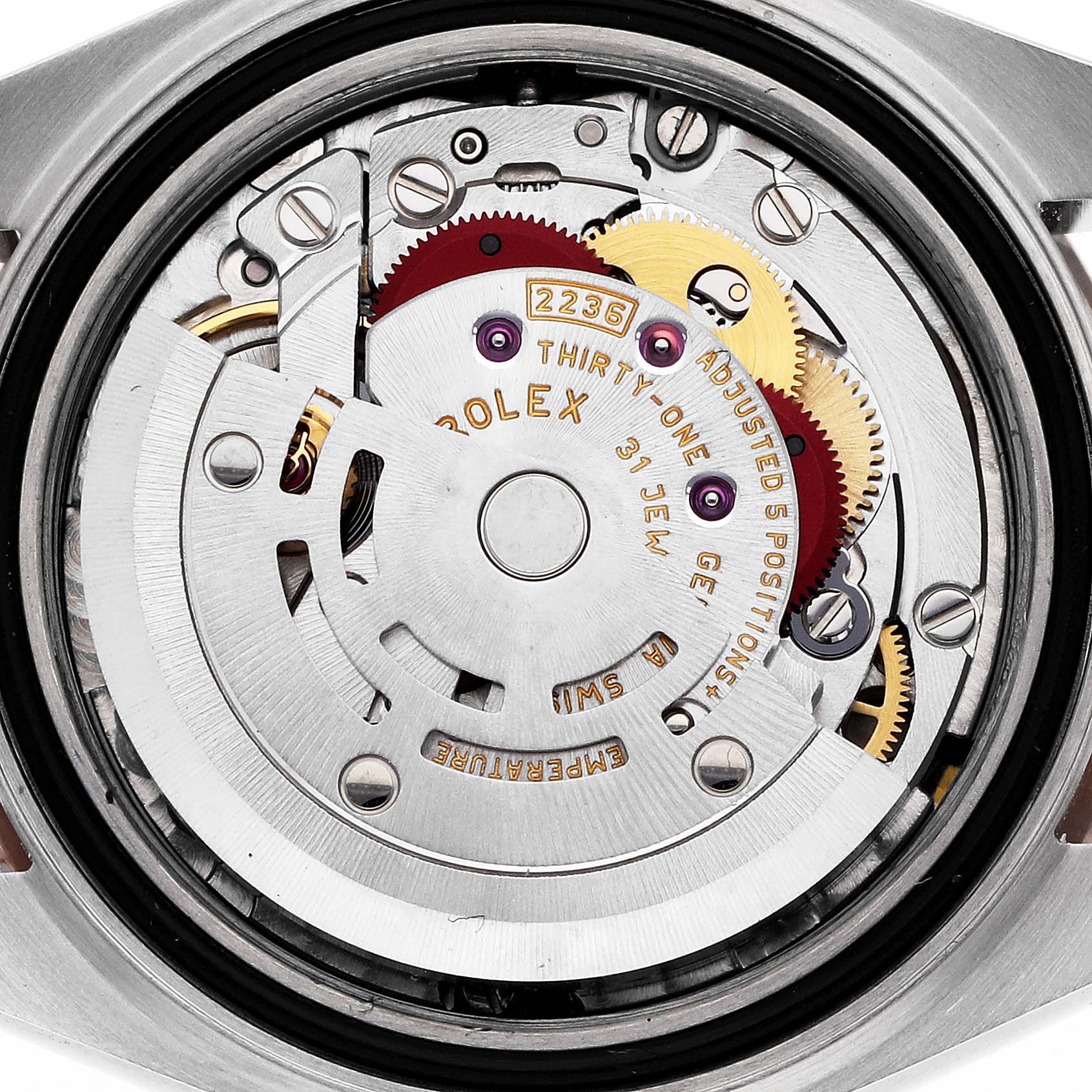 The image shows the movement mechanism of a Rolex Datejust 279381 Women's Stainless Steel Mother of Pearl Dial, viewed from the back, highlighting gears and rotors.