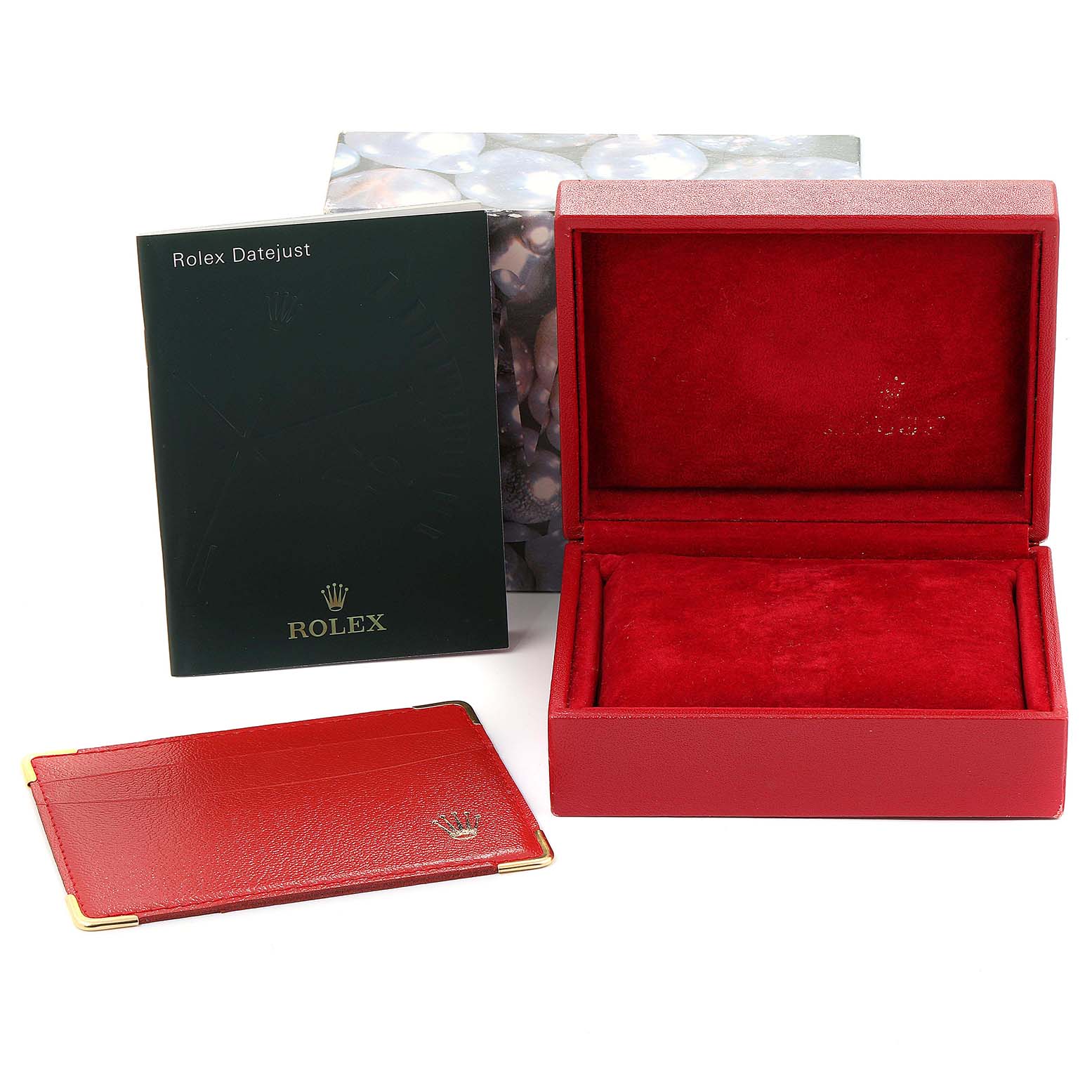 This image shows a Rolex Datejust 179174 Women's White Gold Black Dial 179174 Women's White Gold Black Dial watch box, a wallet, and an instruction manual, all at a straight-on angle.