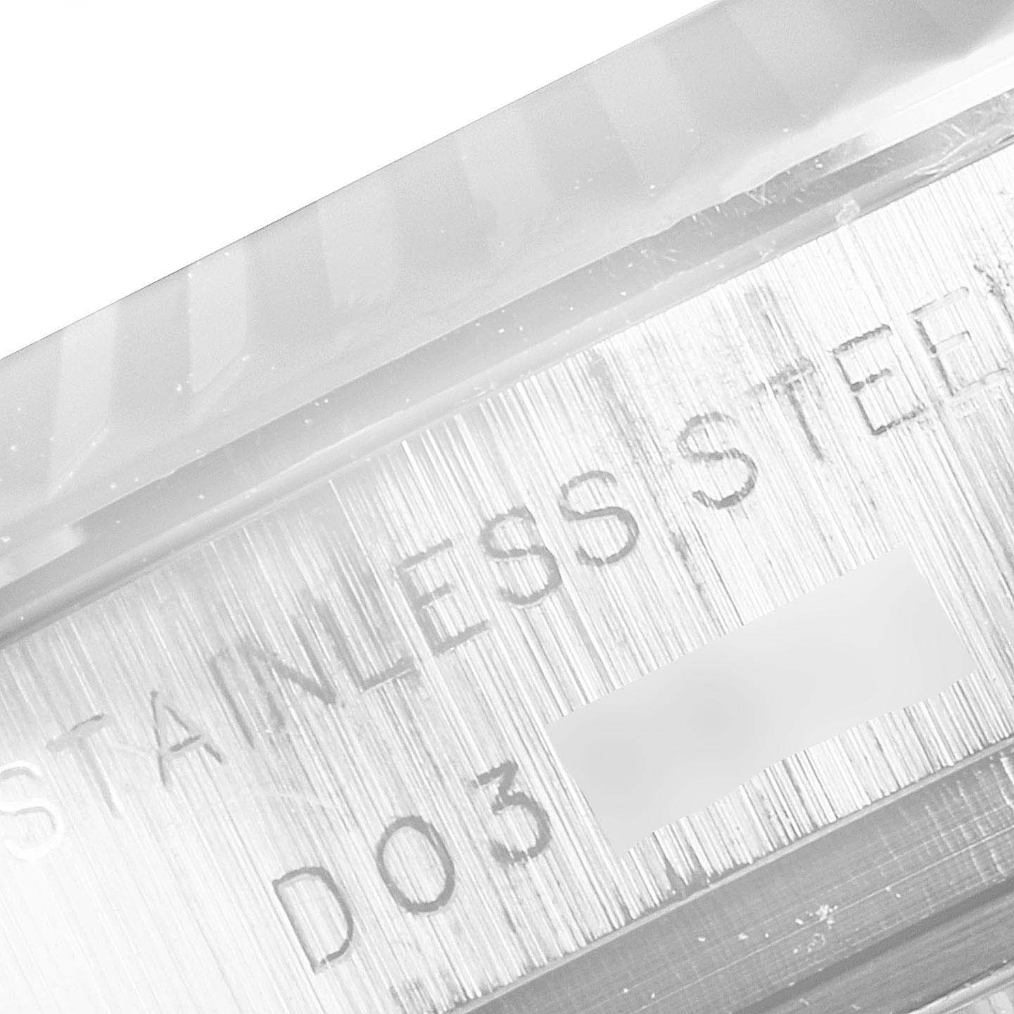 This close-up image of the Rolex Datejust 179174 Women's White Gold Black Dial 179174 Women's White Gold Black Dial watch showcases the engraved text on its stainless steel surface.