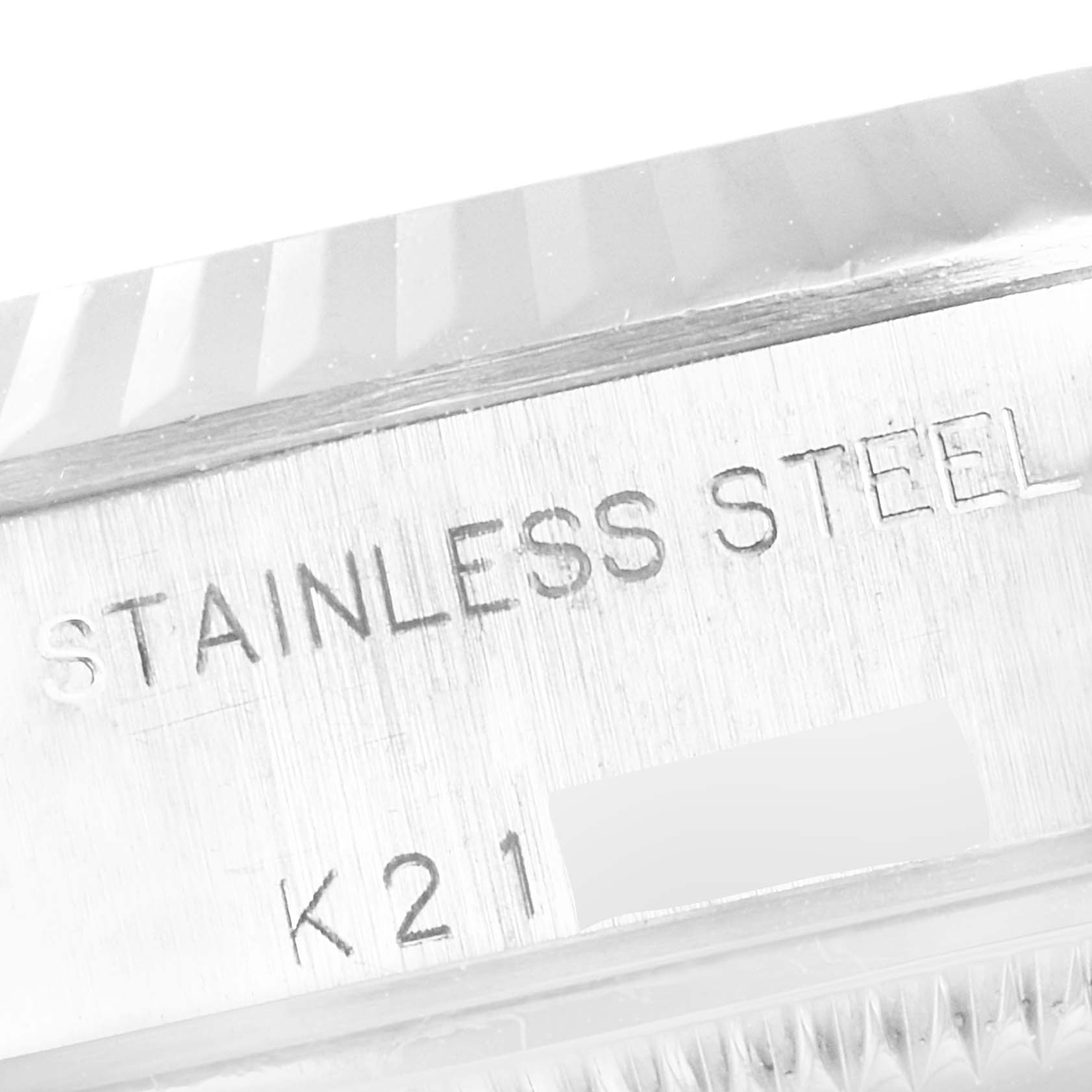 This image shows a close-up of the engraved markings on the case side of a Rolex Datejust 79174 Women
s Stainless Steel Mother of Pearl Dial 79174 Women
s Stainless Steel Mother of Pearl Dial model, indicating "Stainless Steel."