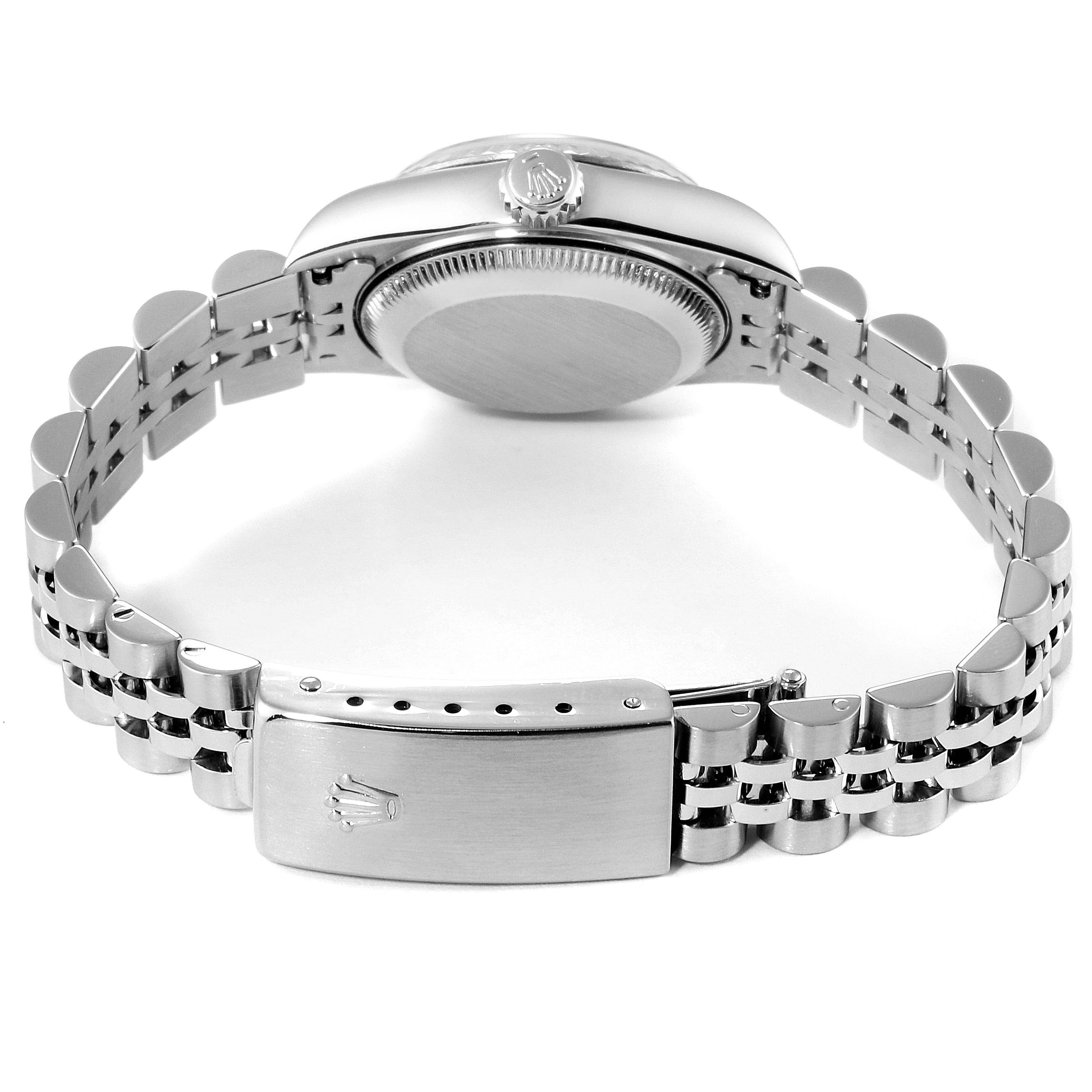 The image shows the Rolex Datejust 79174 Women
s Stainless Steel Mother of Pearl Dial 79174 Women
s Stainless Steel Mother of Pearl Dial watch from the back, highlighting its bracelet and clasp.