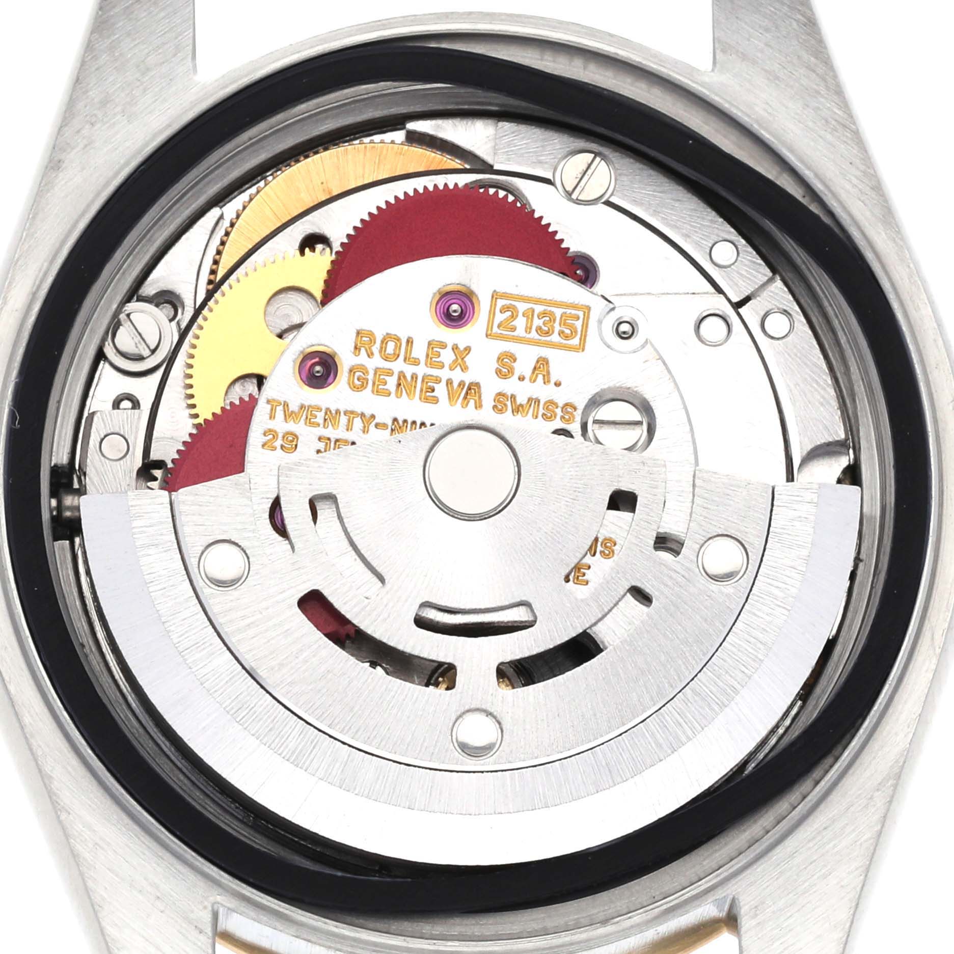 This is a close-up view of the movement mechanism of a Rolex Datejust 69173 Women's Steel and Gold (two tone) Champagne Dial 69173 Women's Steel and Gold (two tone) Champagne Dial watch, showing gears and the rotor.