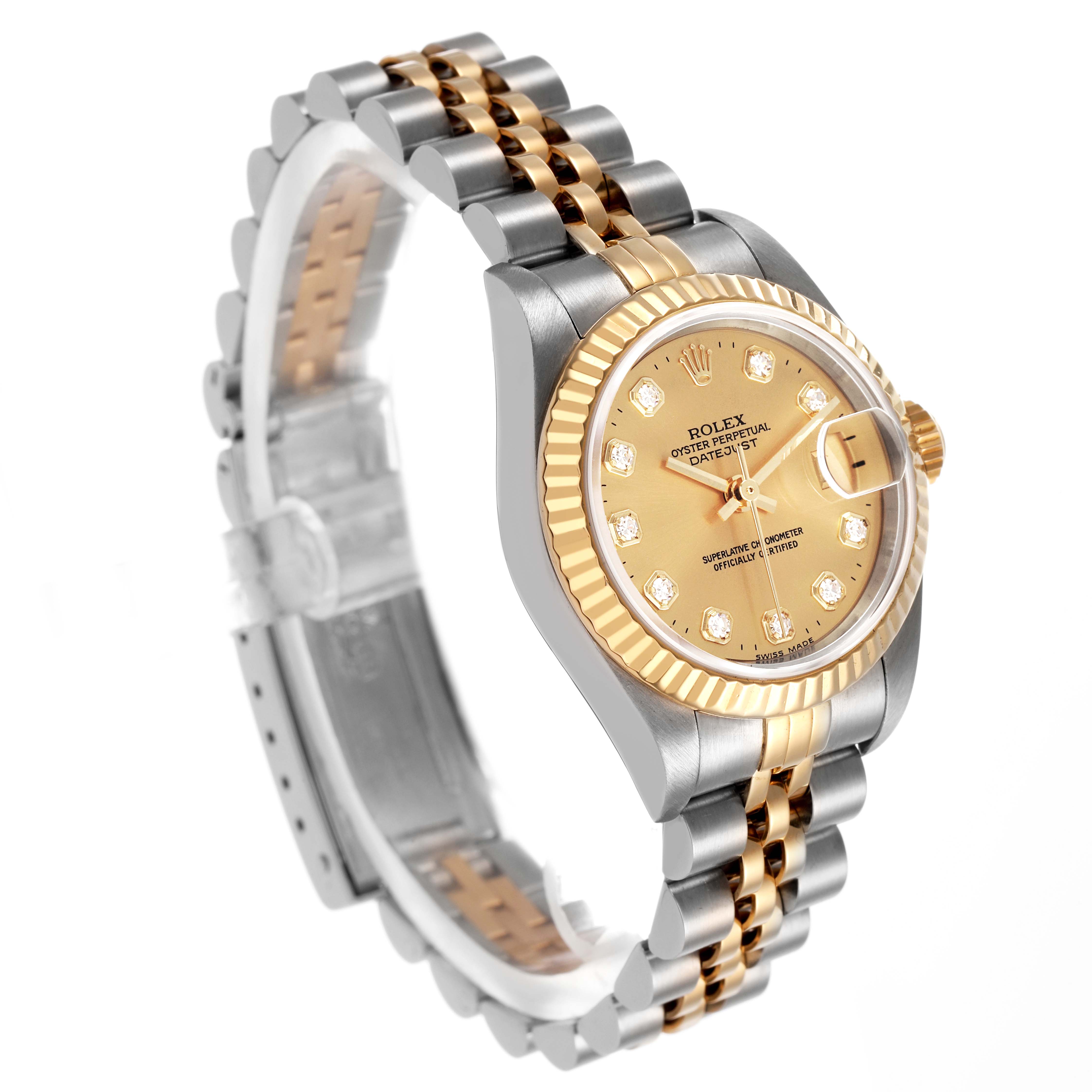 The Rolex Datejust 79173 Women's Steel and Gold (two tone) Champagne Dial watch is shown at a three-quarter angle, displaying the face, bezel, crown, and part of the bracelet.