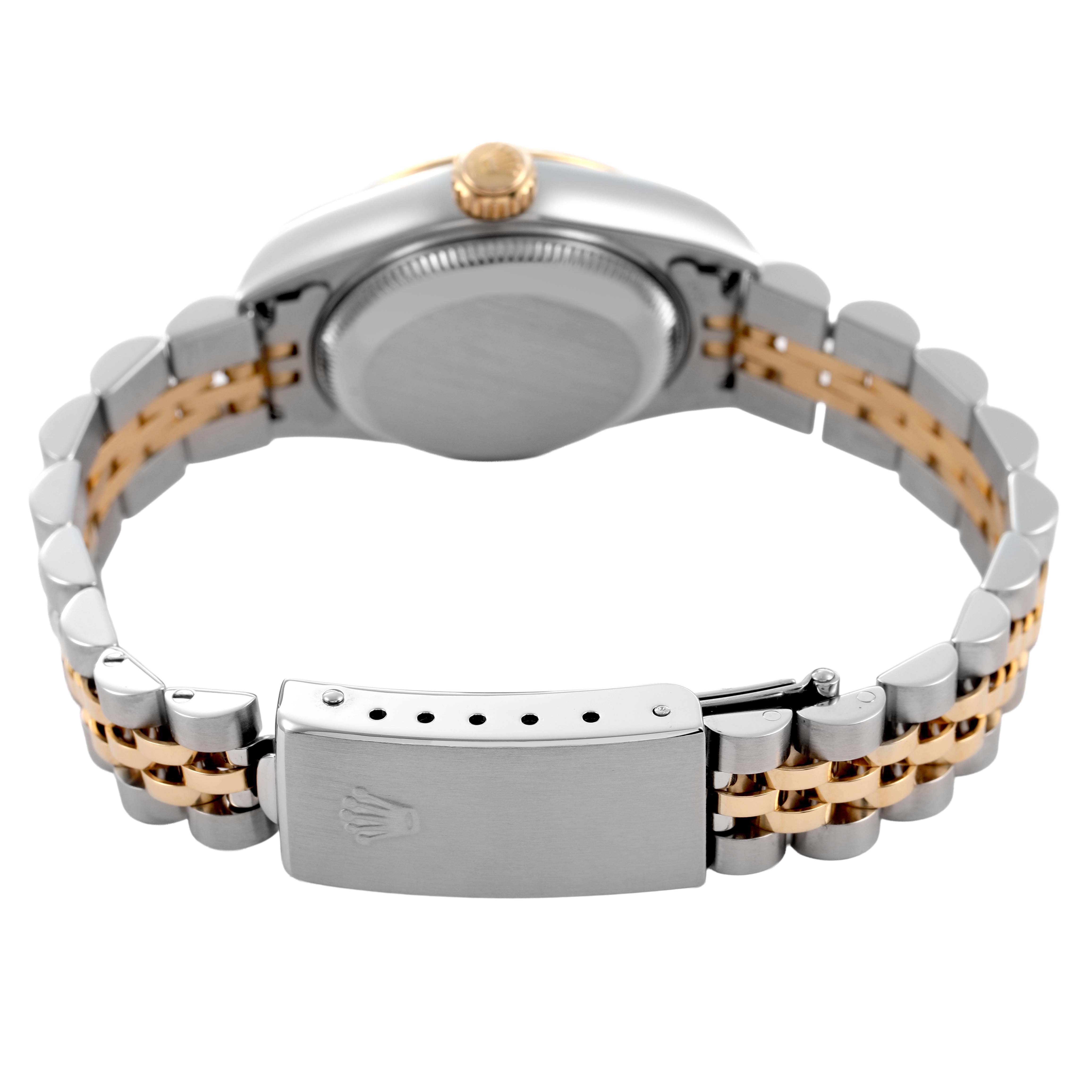 The Rolex Datejust 79173 Women's Steel and Gold (two tone) Champagne Dial watch is shown from the back, highlighting the case back, bracelet, and clasp.