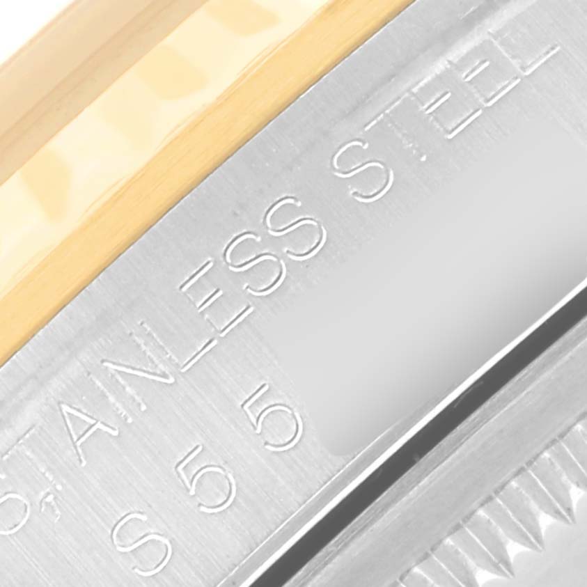 This close-up image shows the stainless steel case edge and part of the bezel of a Rolex Datejust 16233 Men's Steel and Gold (two tone) Champagne Dial 16233 Men's Steel and Gold (two tone) Champagne Dial watch.