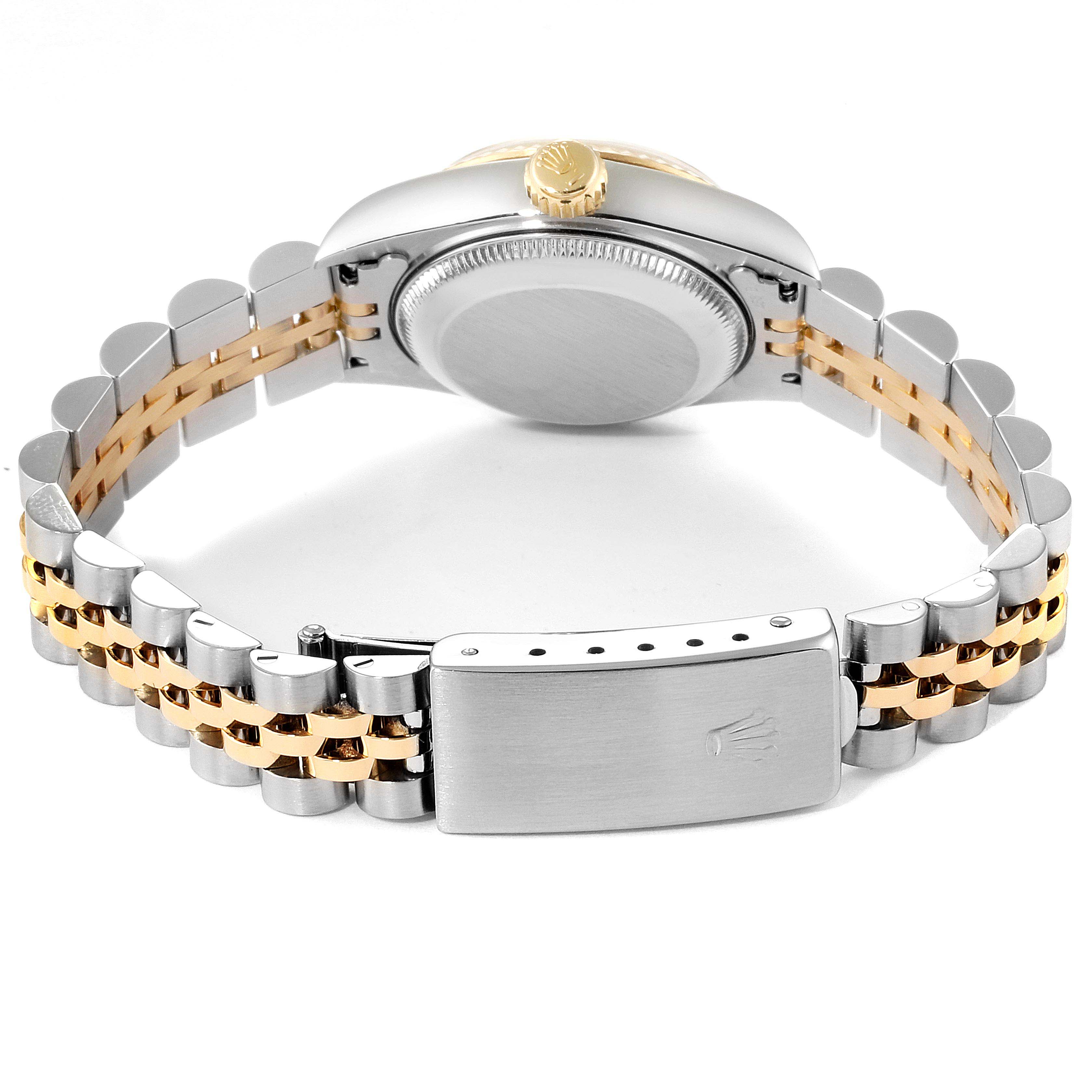 This image shows the backside of the Rolex Datejust 69173 Women
s Steel and Gold (two tone) Champagne Dial 69173 Women
s Steel and Gold (two tone) Champagne Dial watch, featuring the case back, crown, and two-tone bracelet with clasp.