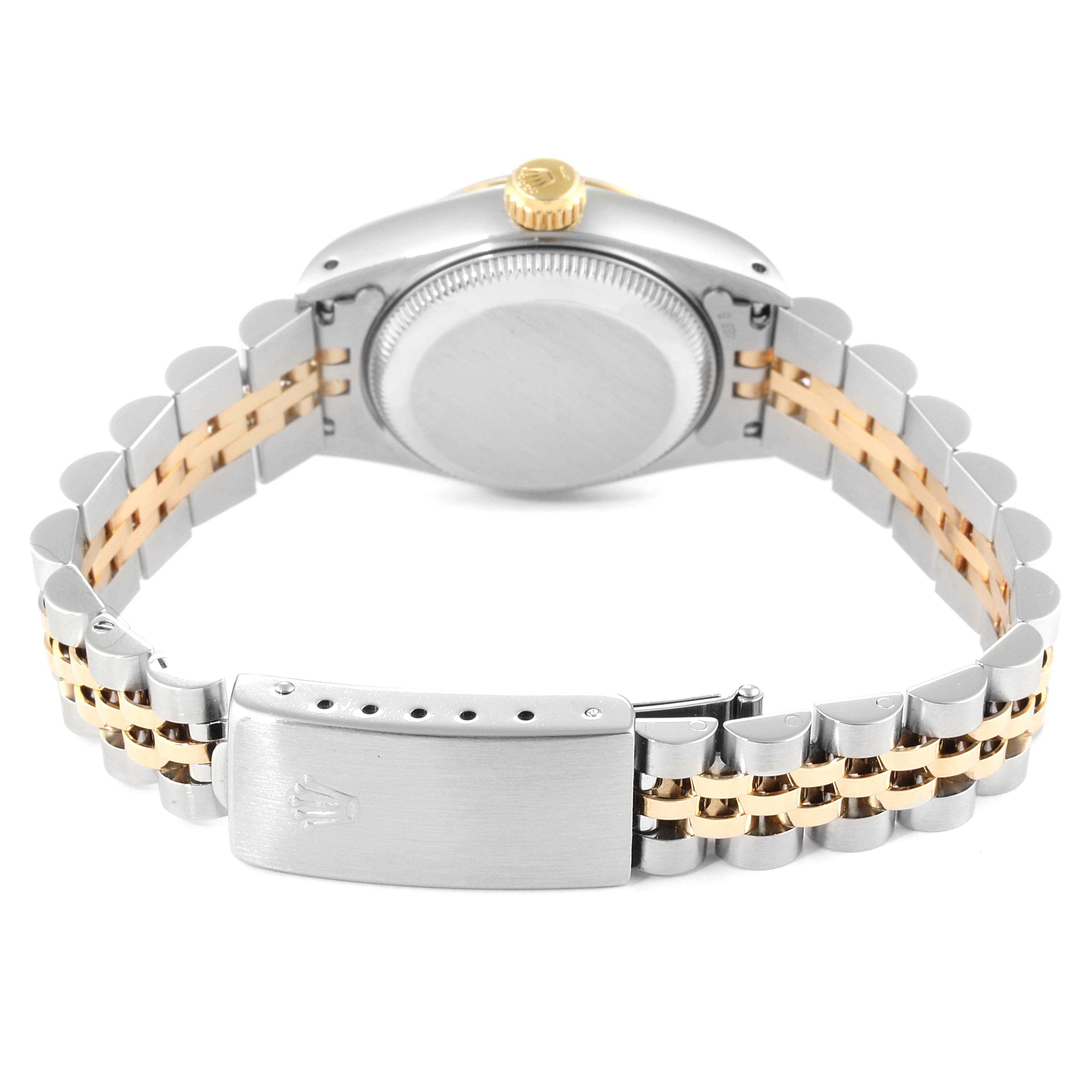 The image shows the back view of a Rolex Datejust 69173 Women
s Steel and Gold (two tone) Champagne Dial 69173 Women
s Steel and Gold (two tone) Champagne Dial watch, highlighting the case back, crown, and two-tone bracelet with clasp.