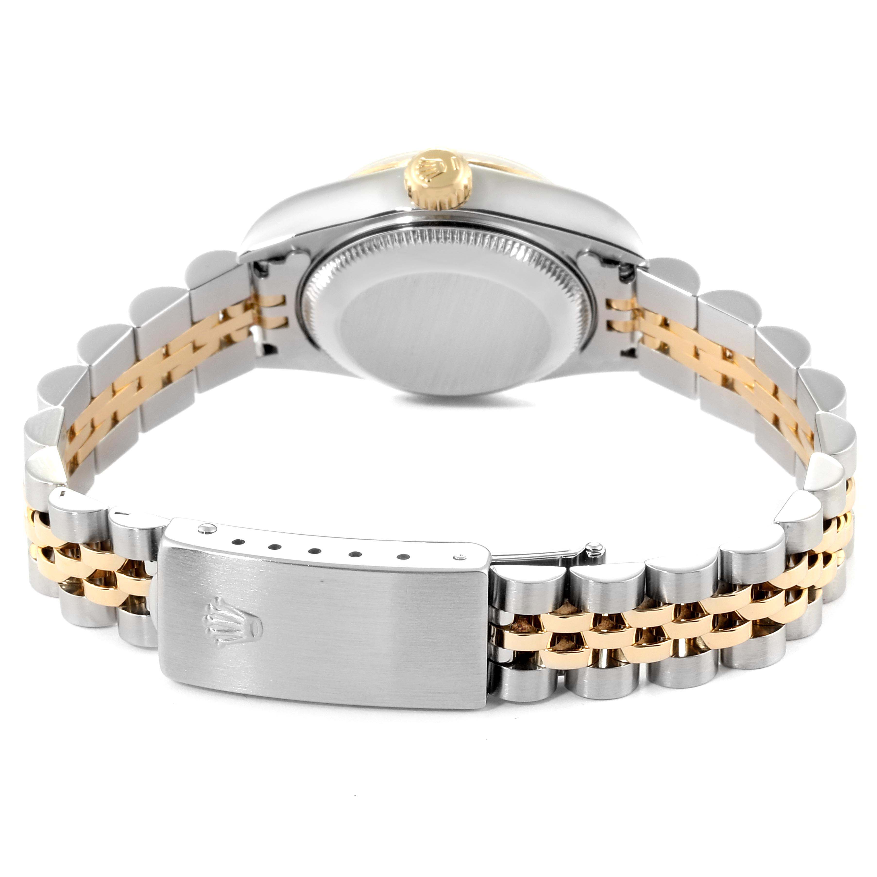 The image shows the back view of a Rolex Datejust 69173 Women
s Steel and Gold (two tone) Champagne Dial 69173 Women
s Steel and Gold (two tone) Champagne Dial, highlighting its clasp, bracelet, and case back.