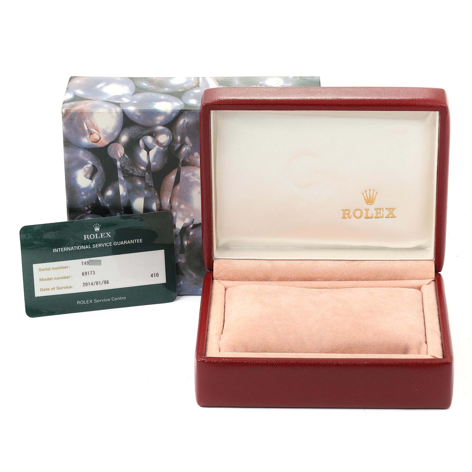 The image shows an empty Rolex Datejust 69173 Women
s Steel and Gold (two tone) Champagne Dial 69173 Women
s Steel and Gold (two tone) Champagne Dial watch box and an international service guarantee card.