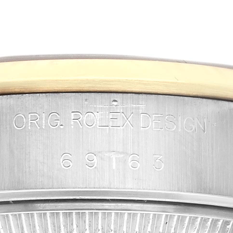 This image shows a close-up of the casing back of a Rolex Datejust 69163 Women's Steel and Gold (two tone) Grey Dial 69163 Women's Steel and Gold (two tone) Grey Dial watch, featuring the engraved model number.