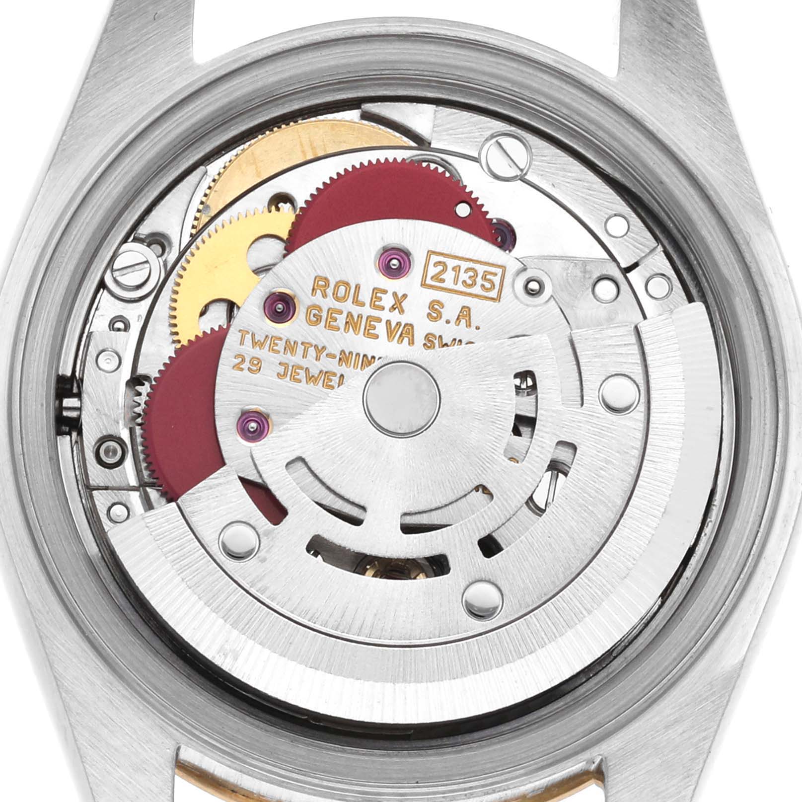 The image shows the inner mechanism of a Rolex Datejust 69163 Women's Steel and Gold (two tone) Grey Dial 69163 Women's Steel and Gold (two tone) Grey Dial watch, viewed from the back with detailed gears and the inscribed rotor visible.