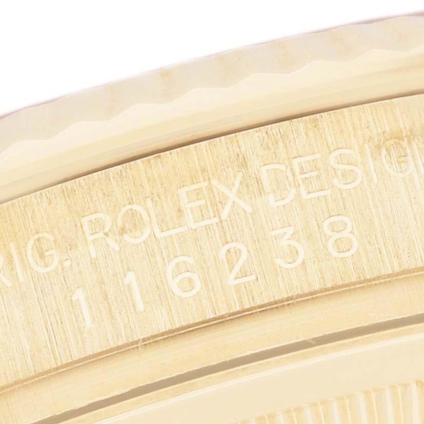 The image shows a close-up of the engraved serial number and branding on the side of a Rolex Datejust 116238 Men's Yellow Gold Mother of Pearl Dial 116238 Men's Yellow Gold Mother of Pearl Dial model.