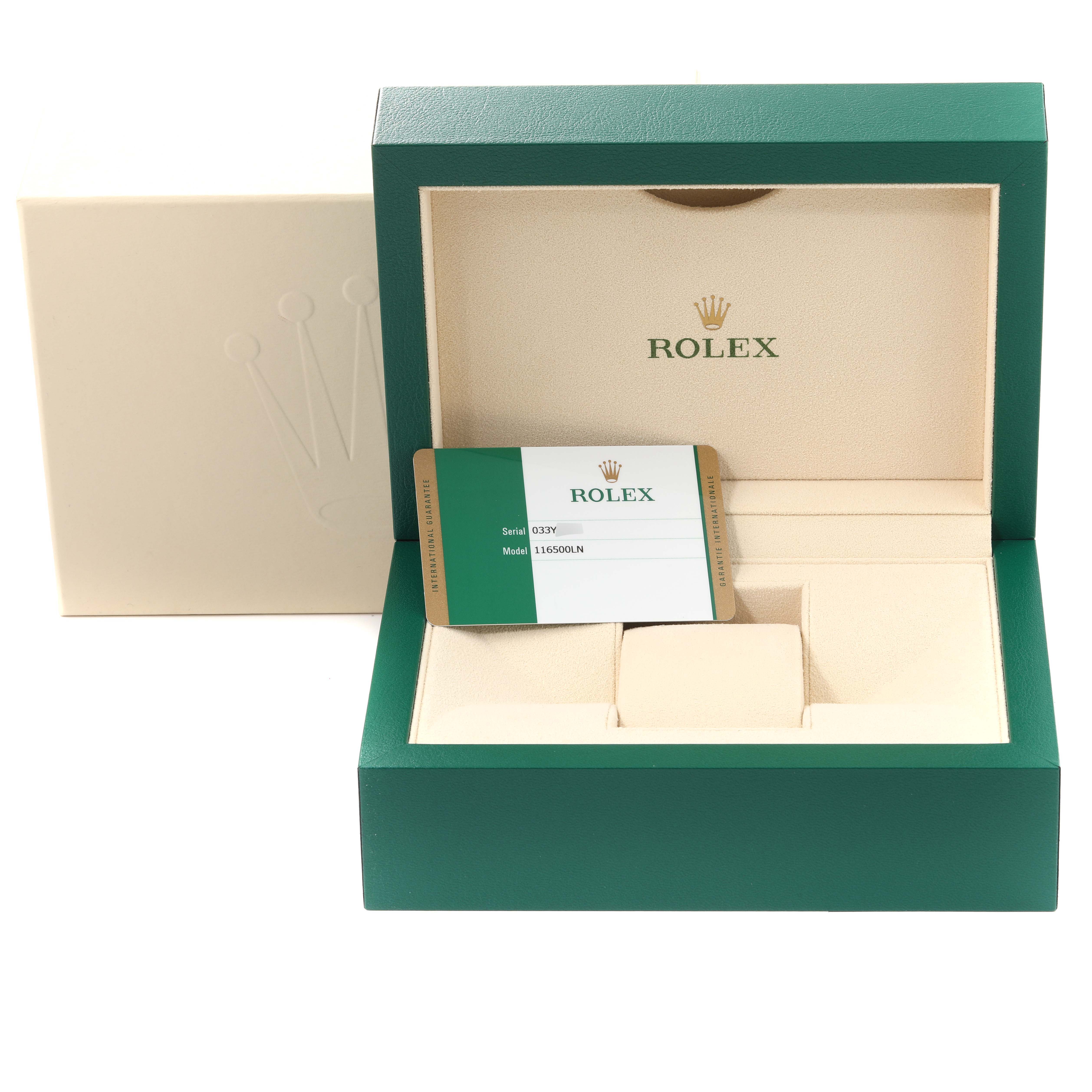 This image shows the packaging and warranty card of a Rolex Daytona 116500LN Men's Stainless Steel White Dial 116500LN Men's Stainless Steel White Dial model watch, with an open box showing compartments.