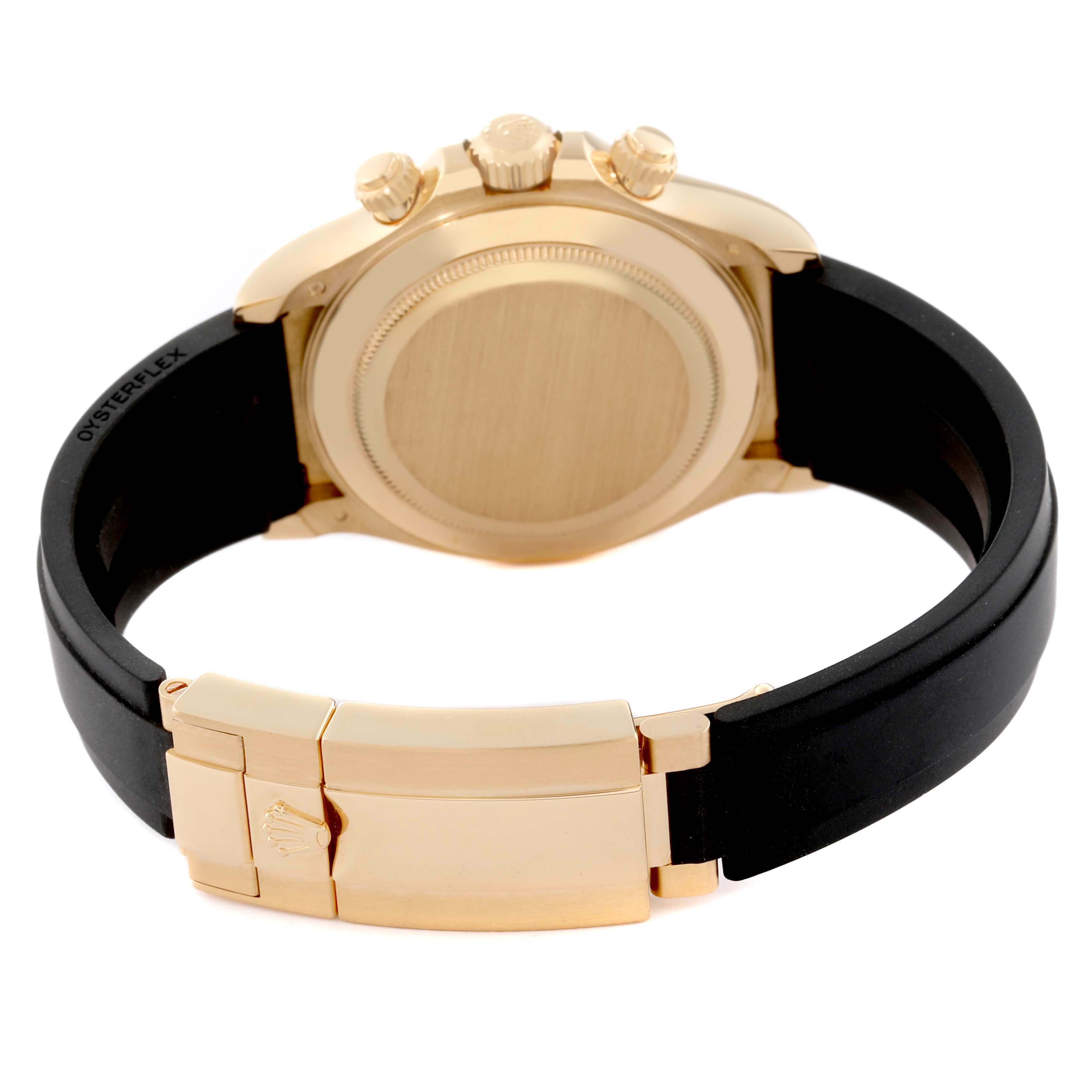 This image shows the back and clasp of a Rolex Daytona 116518 Men's Yellow Gold Champagne Dial 116518 Men's Yellow Gold Champagne Dial watch with a black strap and gold case.