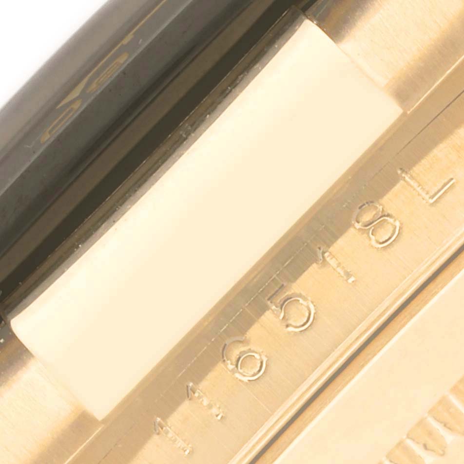The image shows a close-up of the case and model engraving on the side of the Rolex Daytona 116518 Men's Yellow Gold Champagne Dial 116518 Men's Yellow Gold Champagne Dial watch.