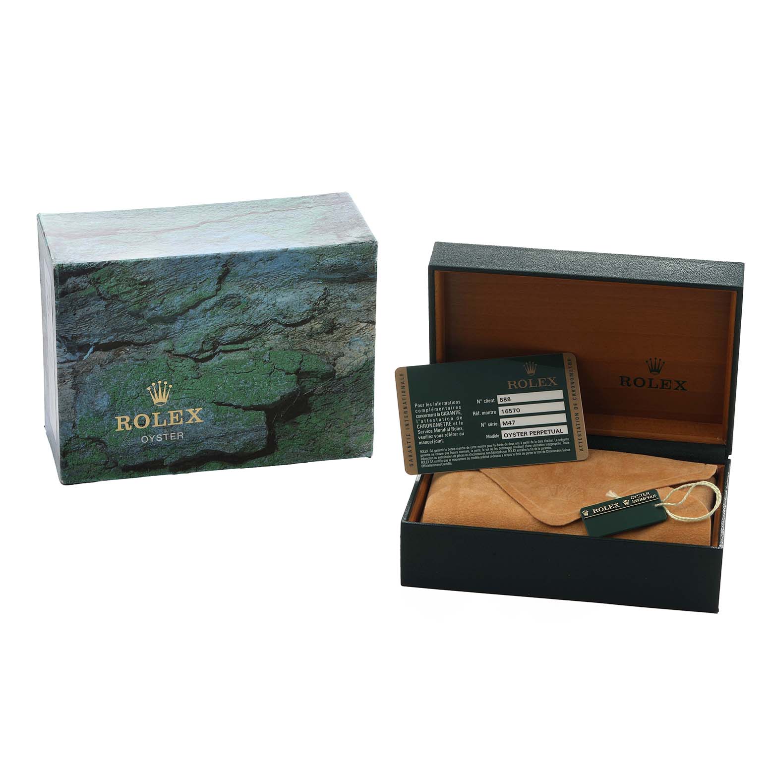 The image shows a Rolex Explorer 216570 Men
s Stainless Steel Black Dial box with a warranty card and a tag, featuring the open case and outer box from a side angle.