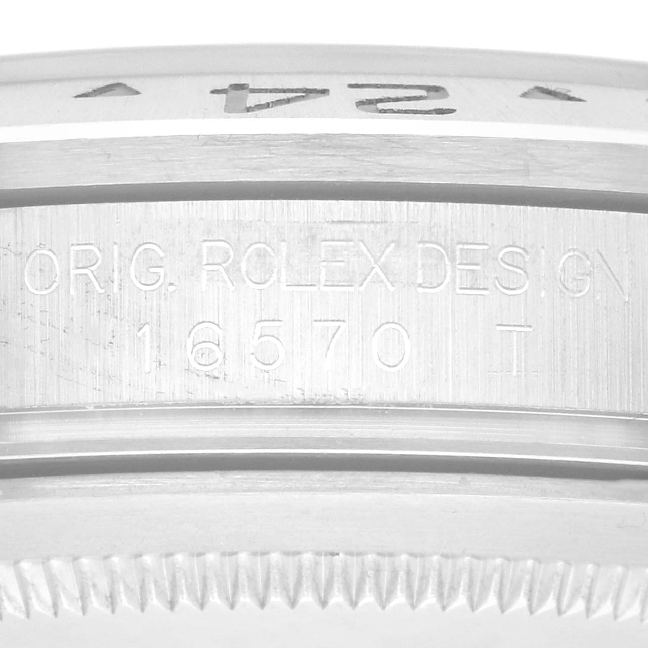 The image shows a close-up of the side engraving and bezel edge of a Rolex Explorer 216570 Men
s Stainless Steel Black Dial model watch.