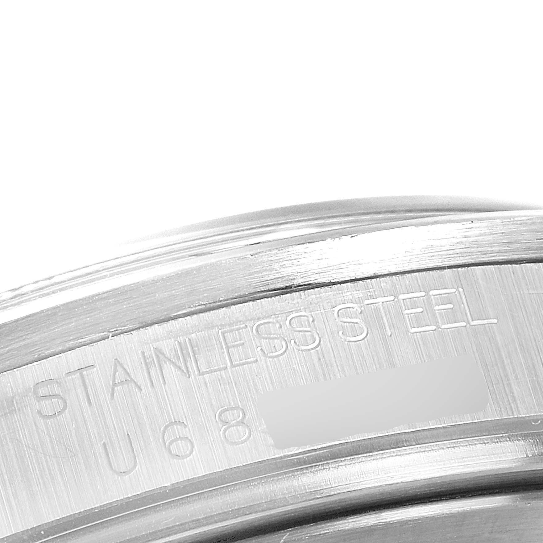 This close-up image shows the stainless steel back and serial number engraving of a Rolex Explorer 16570 Men's Stainless Steel Black Dial 16570 Men's Stainless Steel Black Dial watch.