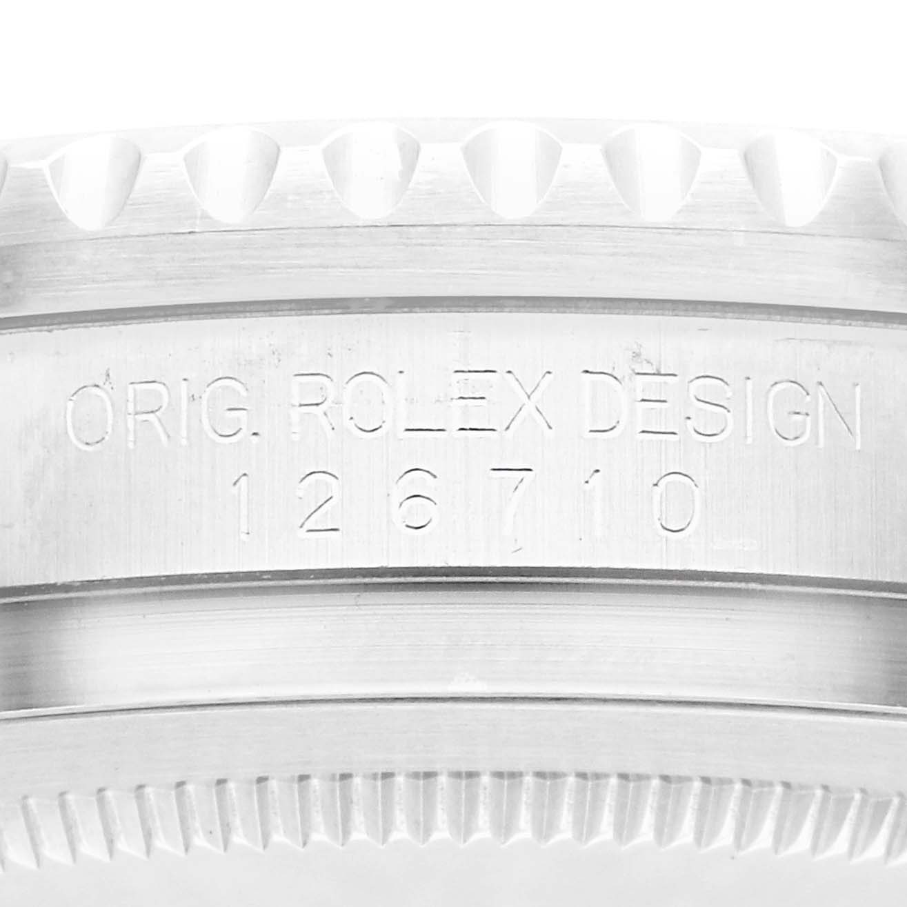 The image shows a close-up side angle of the Rolex GMT-Master 126710 Men
s Stainless Steel Black Dial watch case, featuring the model engraving "126710".