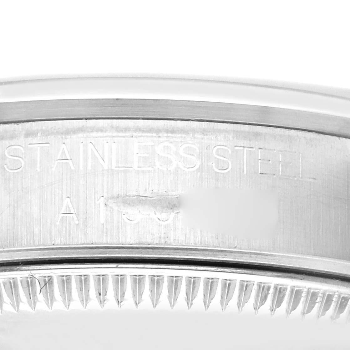 The image shows the side engraving on the stainless steel case back of a Rolex Mid-Size 68240 Women's Stainless Steel Black Dial 68240 Women's Stainless Steel Black Dial model watch.