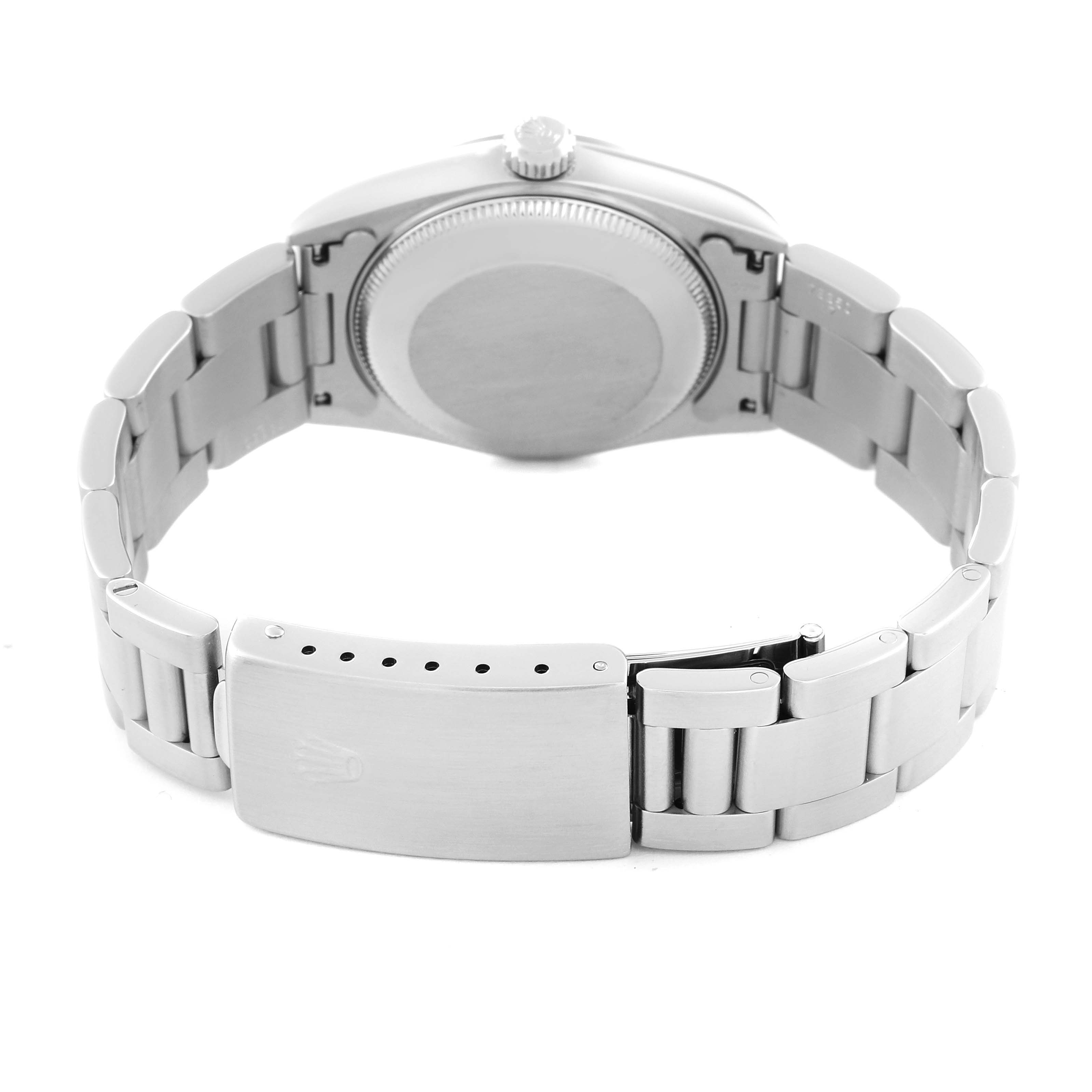 The image shows the back case and bracelet clasp of a Rolex Mid-Size 68240 Women's Stainless Steel Black Dial 68240 Women's Stainless Steel Black Dial watch from a rear angle.