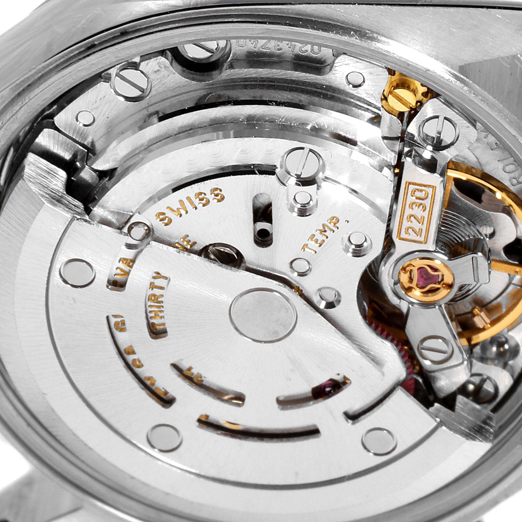 This image shows a close-up view of the movement mechanism inside a Rolex Oyster Perpetual 76080 Women
s Stainless Steel Black Dial 76080 Women
s Stainless Steel Black Dial watch.