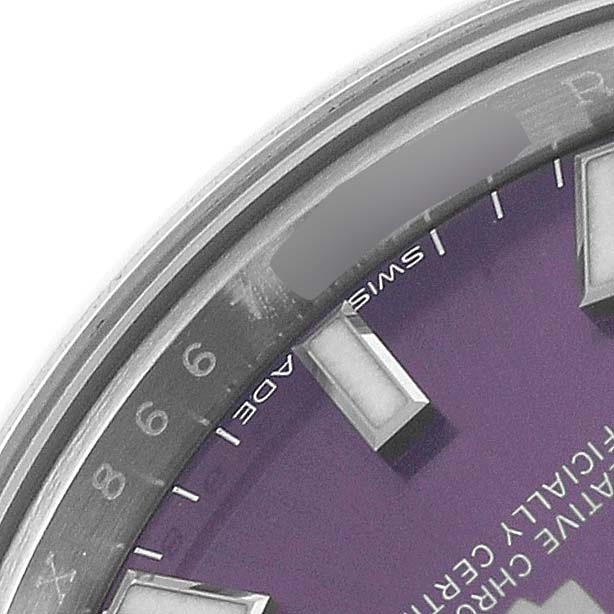 The close-up angle shows part of the dial and bezel of the Rolex Oyster Perpetual 176200 Women's Stainless Steel Purple Dial watch.