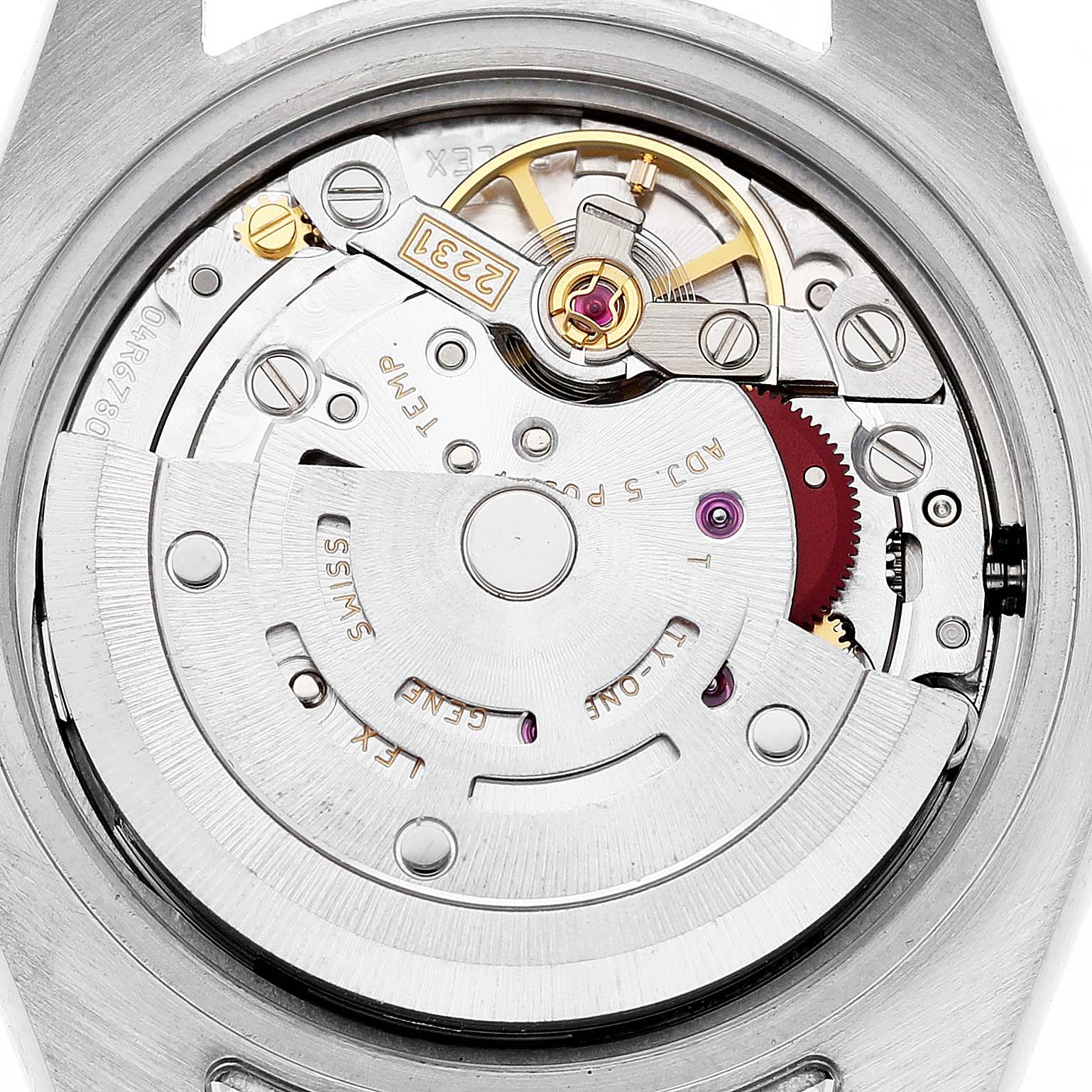 This image shows the movement of a Rolex Oyster Perpetual 176200 Women's Stainless Steel Purple Dial watch from the back, highlighting the rotor and other internal mechanics.